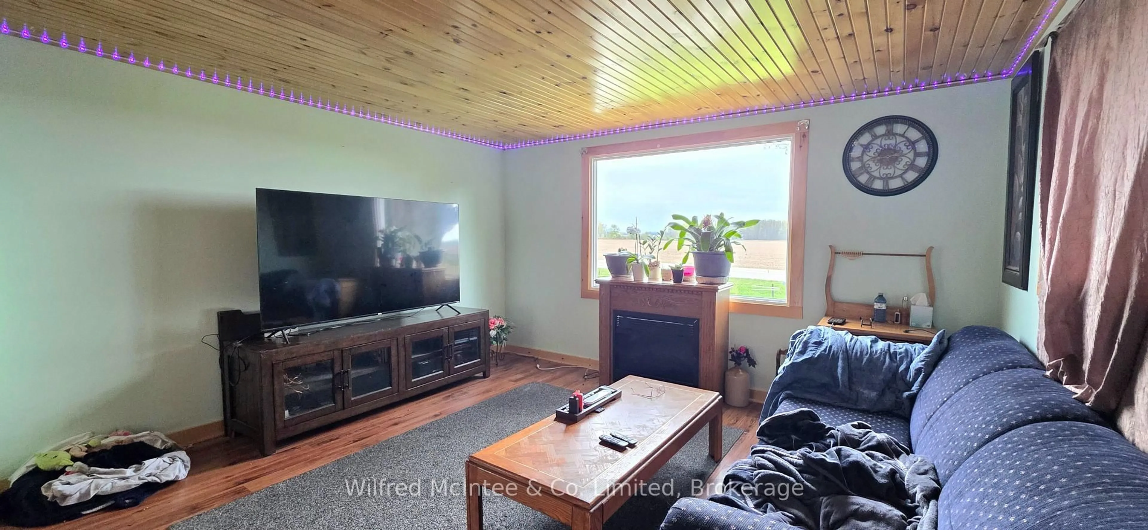 Living room with furniture, wood/laminate floor for 10 Quebec Rd, Huron East Ontario N0M 1L0