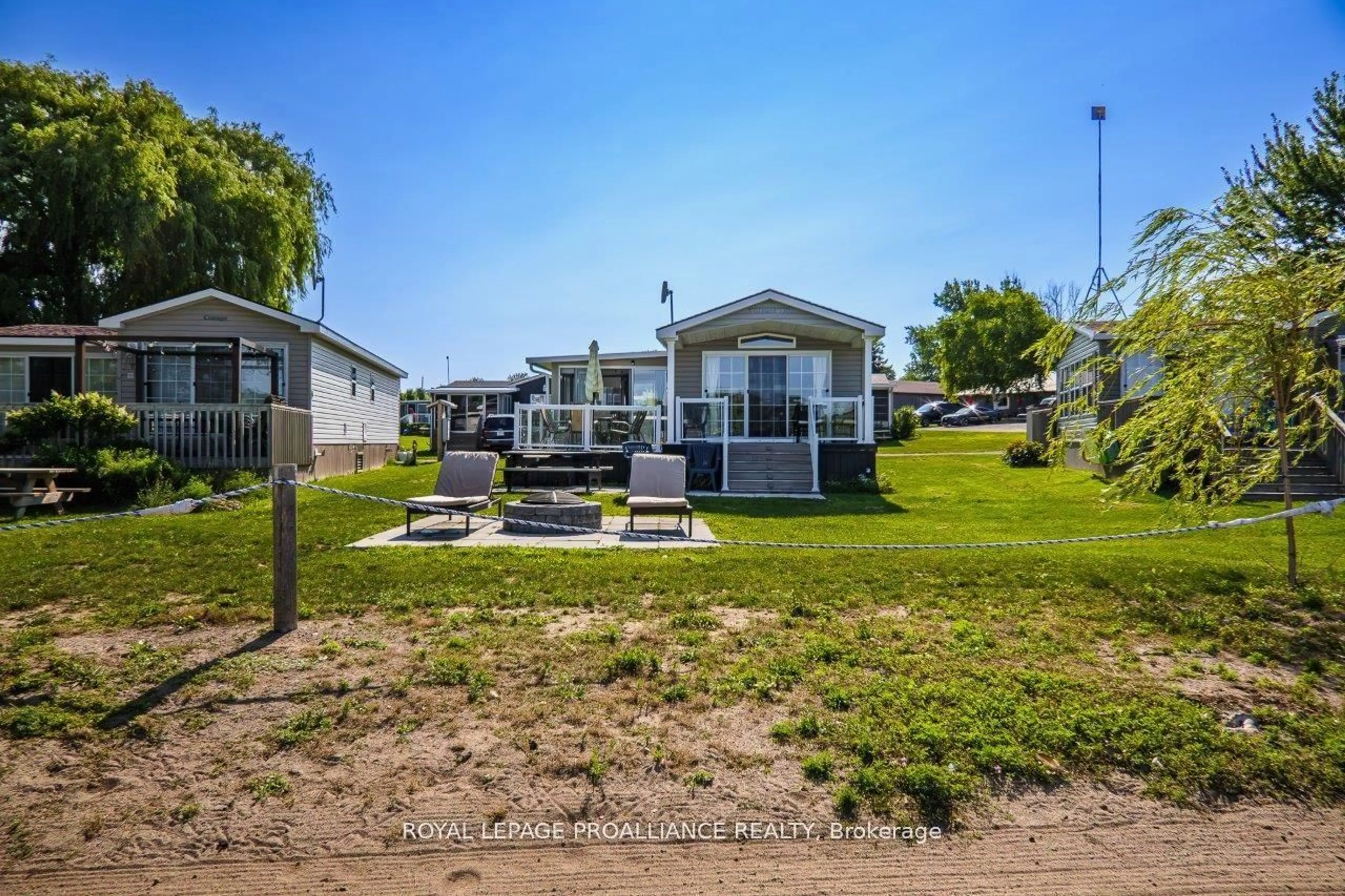 A pic from outside/outdoor area/front of a property/back of a property/a pic from drone, unknown for 486 Cty Rd 18 - 3 Beachview Lane, Prince Edward County Ontario K0K 1P0