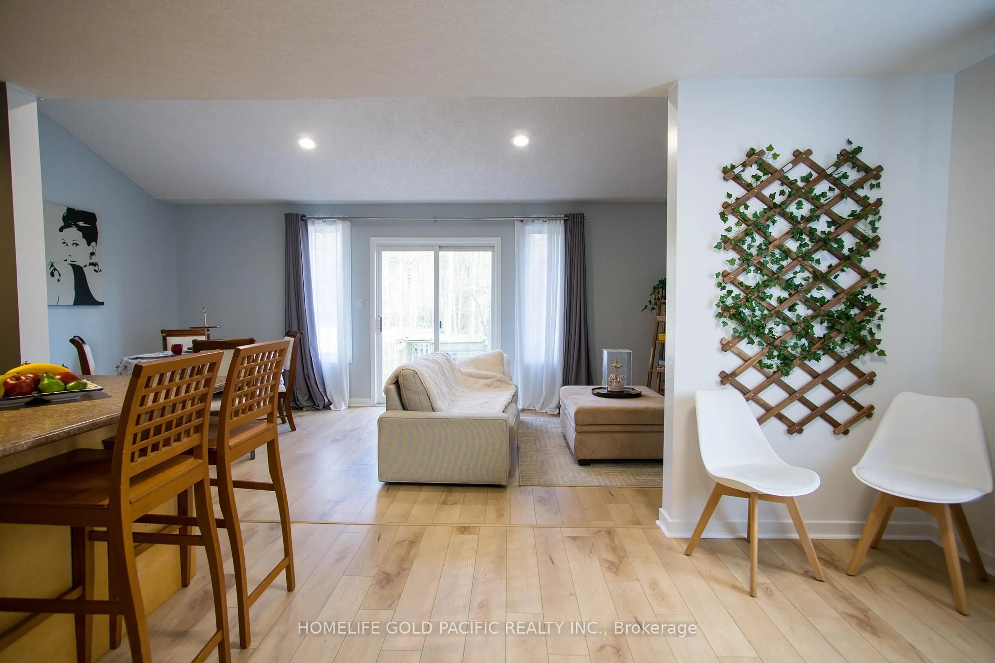 Living room with furniture, wood/laminate floor for 655 Inglis Falls Pl, Waterloo Ontario N2V 2L4