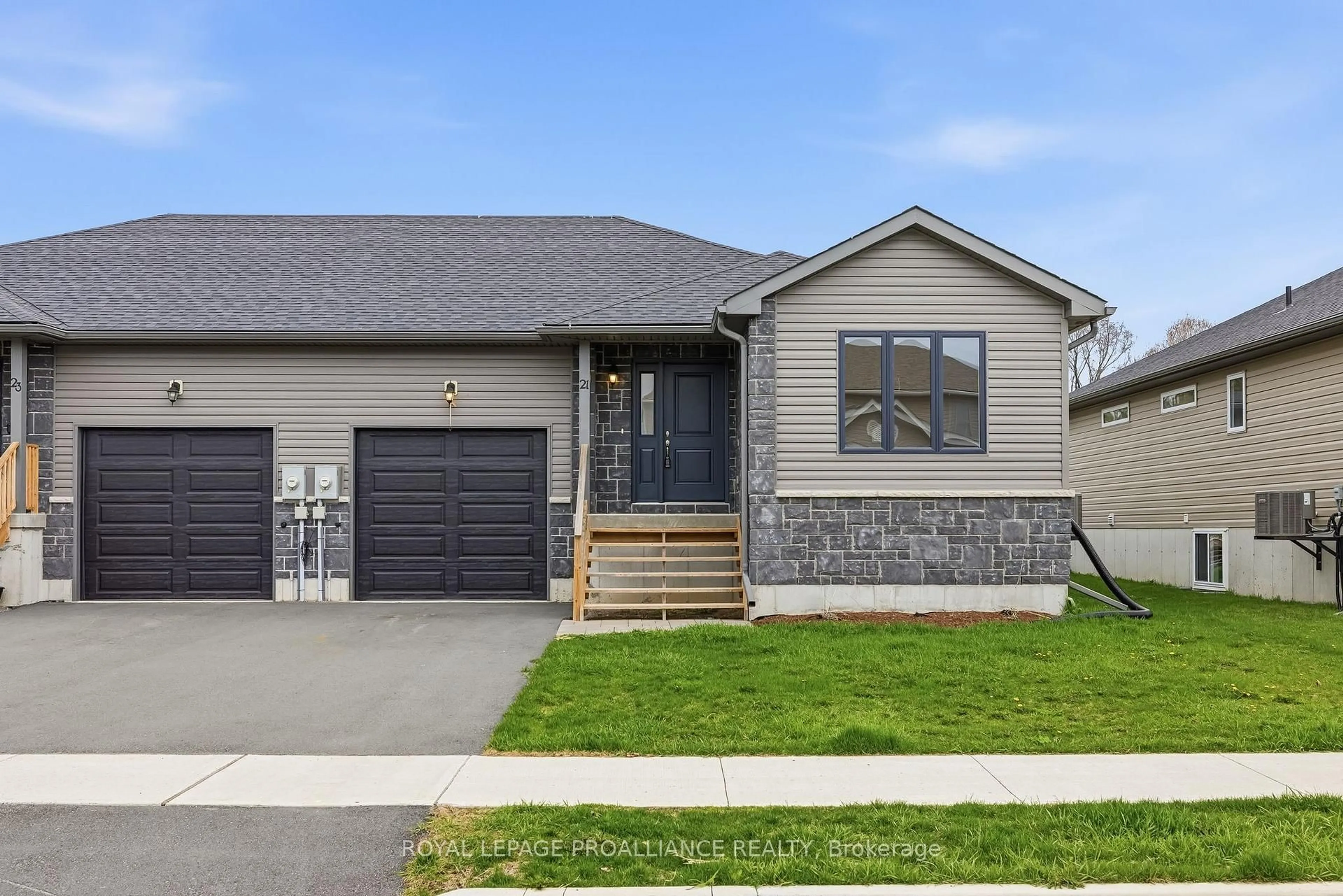 Home with vinyl exterior material, street for 21 Rabbit Rd, Brighton Ontario K0K 1H0
