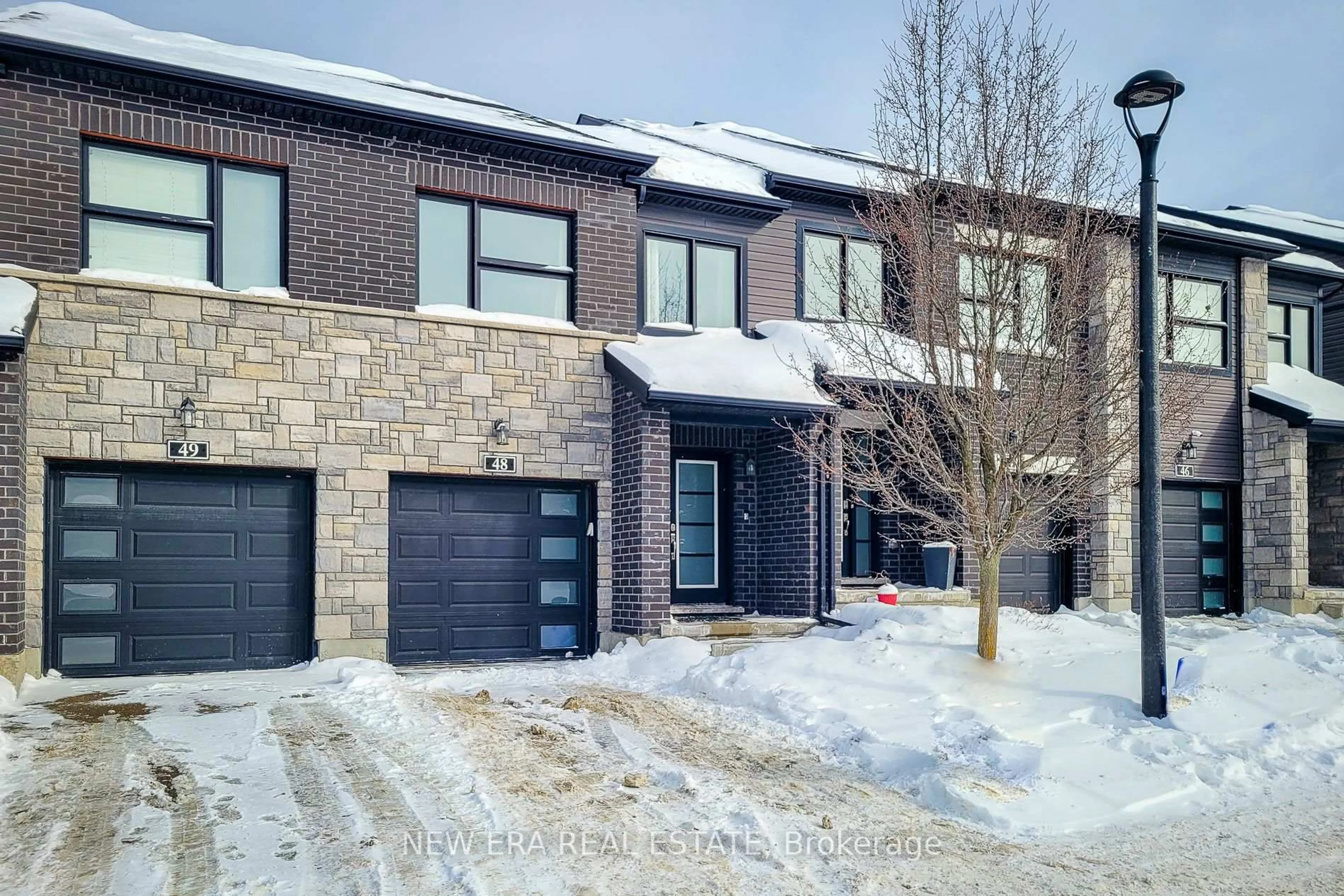 Home with brick exterior material, street for 91 Poppy Dr #48, Guelph Ontario N1L 0M6