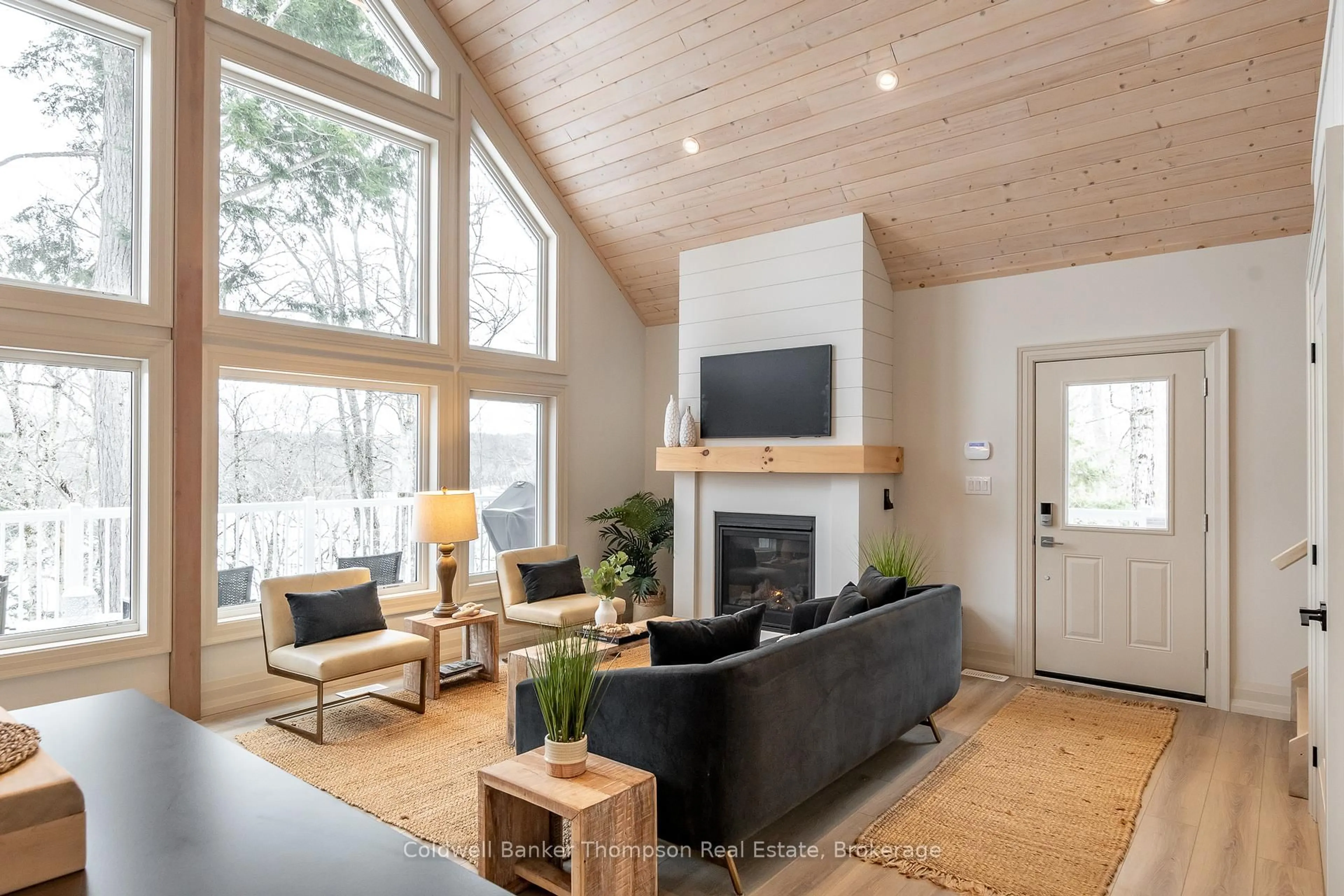 Living room with furniture, wood/laminate floor for 63 Maple Dr, Perry Ontario P0A 1J0