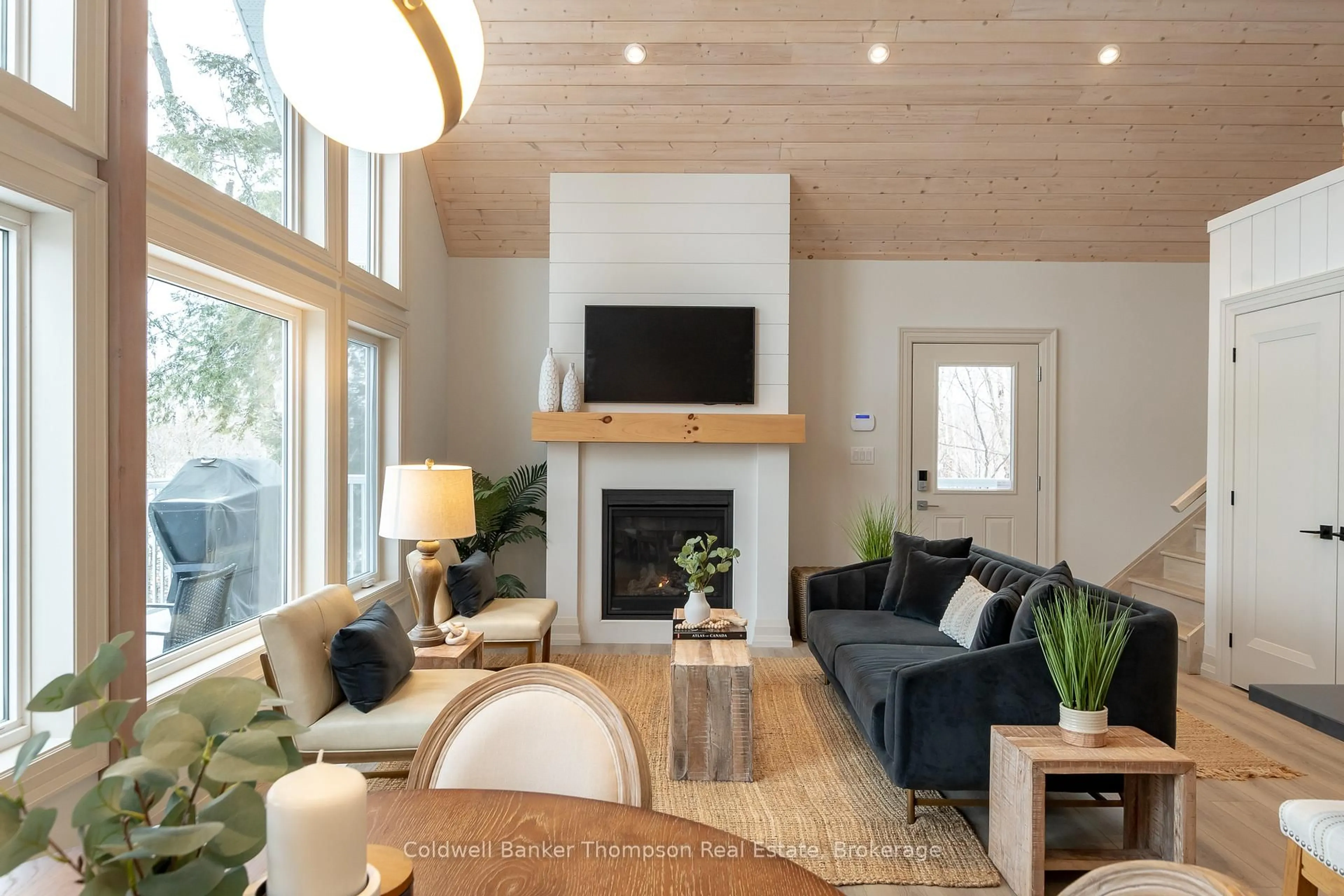 Living room with furniture, wood/laminate floor for 63 Maple Dr, Perry Ontario P0A 1J0