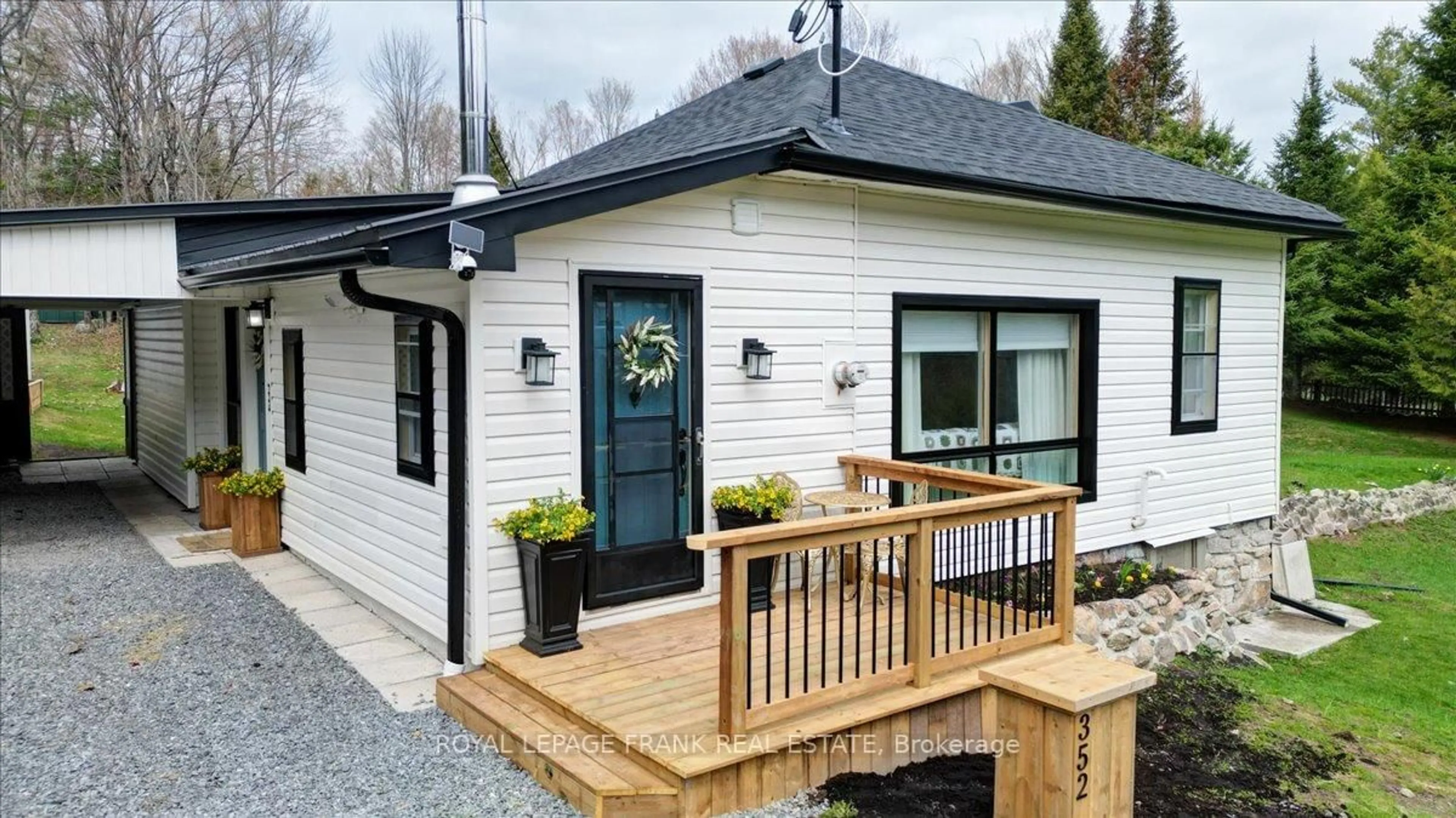 Home with vinyl exterior material, street for 352 Lasswade Rd, North Kawartha Ontario K0L 1A0