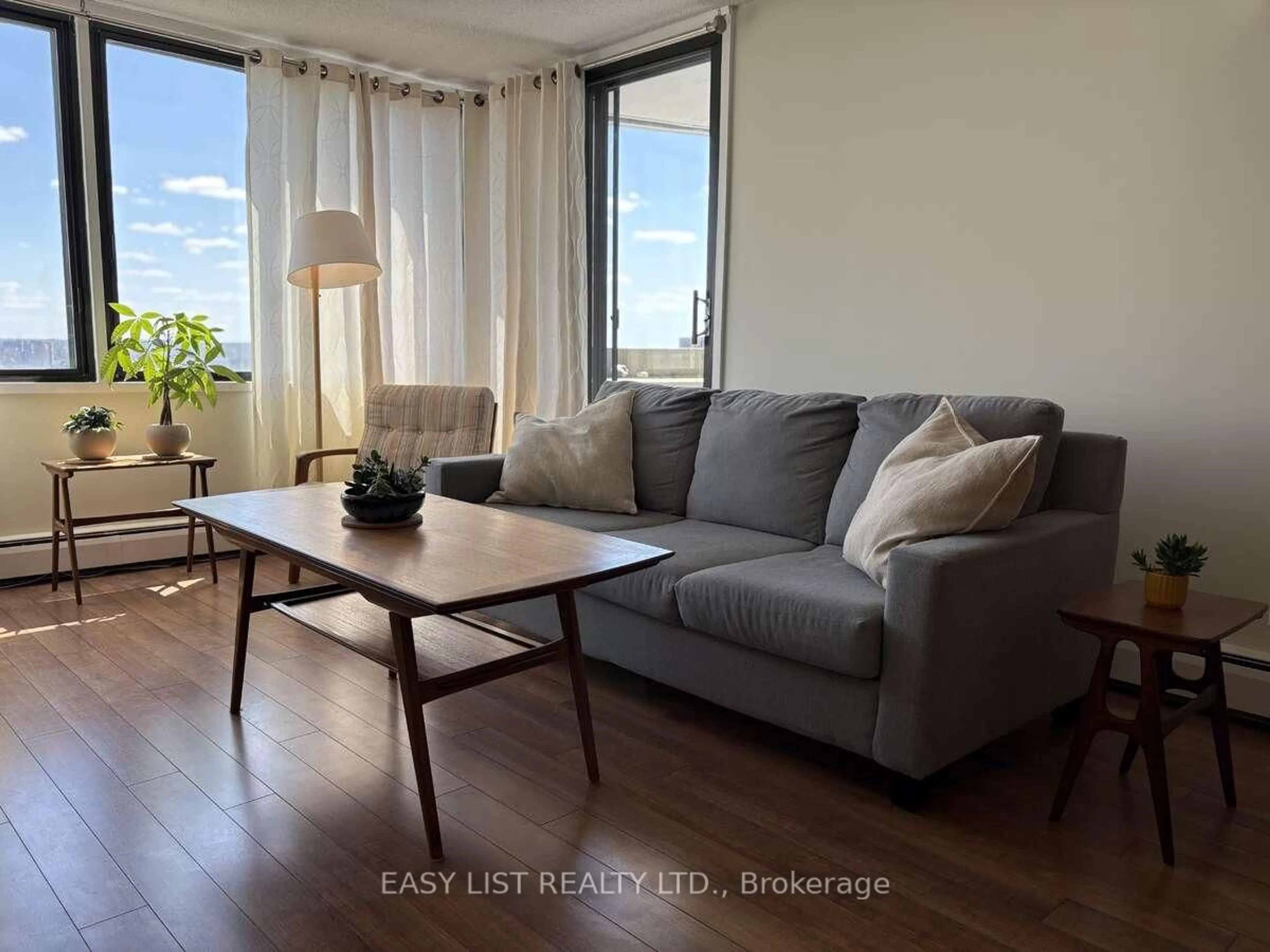 Living room with furniture, wood/laminate floor for 415 Greenview Ave #2005, Ottawa Ontario K2B 8G5