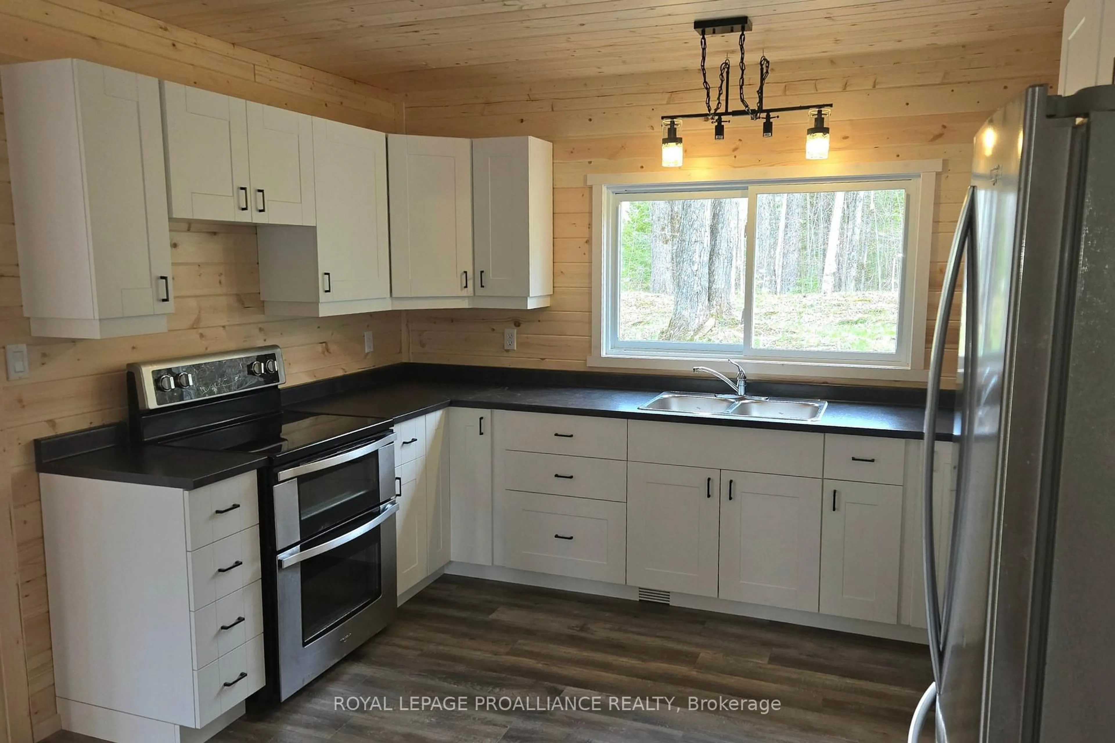 Standard kitchen, wood/laminate floor for 1049 South Rd, Cloyne Ontario K0H 1K0