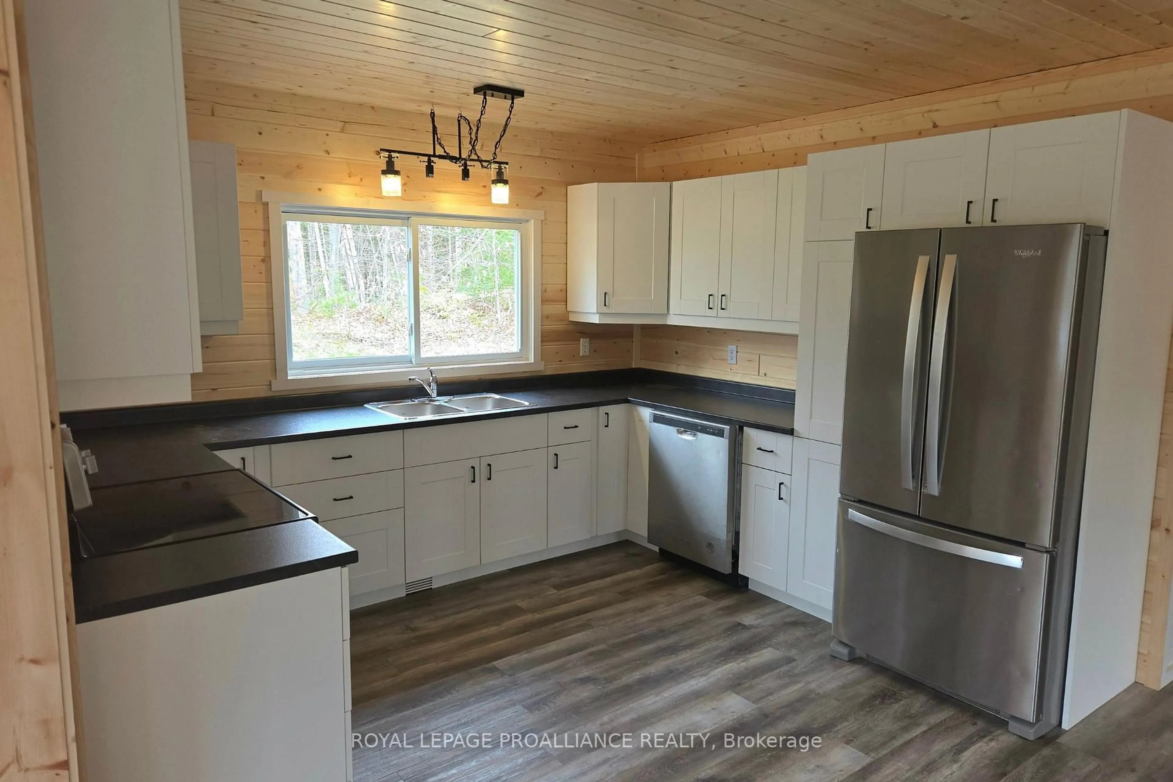Open concept kitchen, wood/laminate floor for 1049 South Rd, Cloyne Ontario K0H 1K0