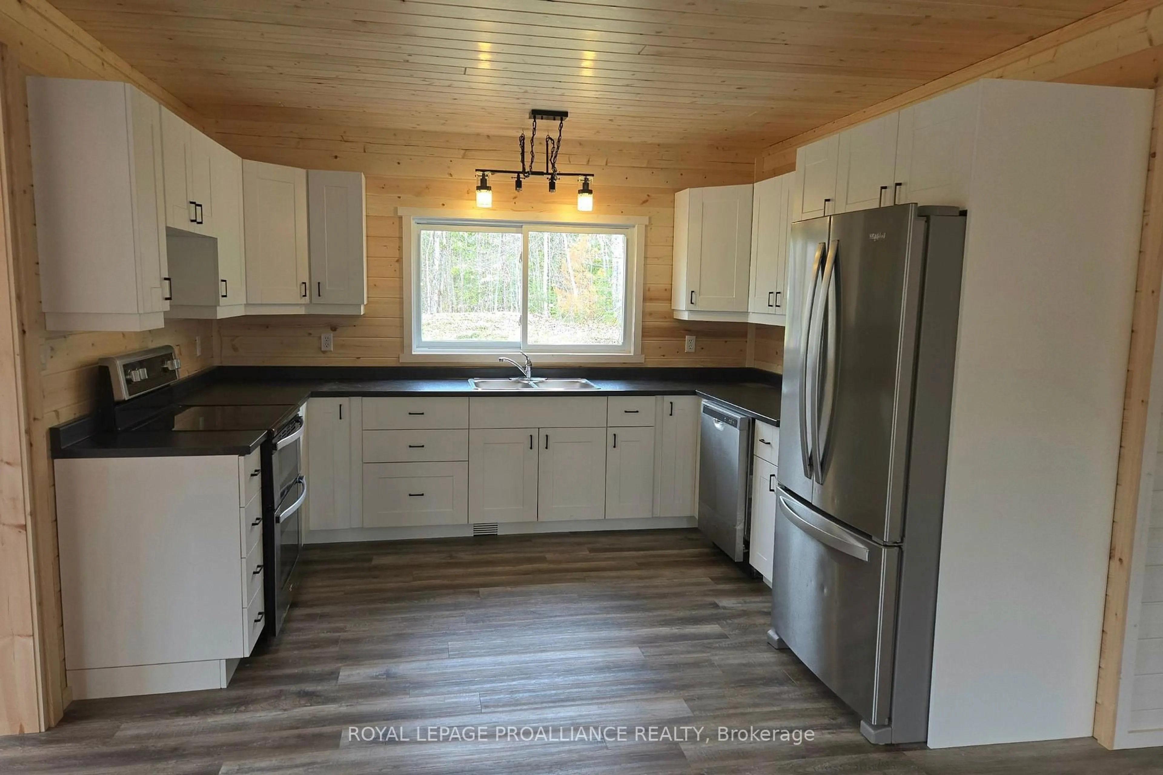 Open concept kitchen, wood/laminate floor for 1049 South Rd, Cloyne Ontario K0H 1K0