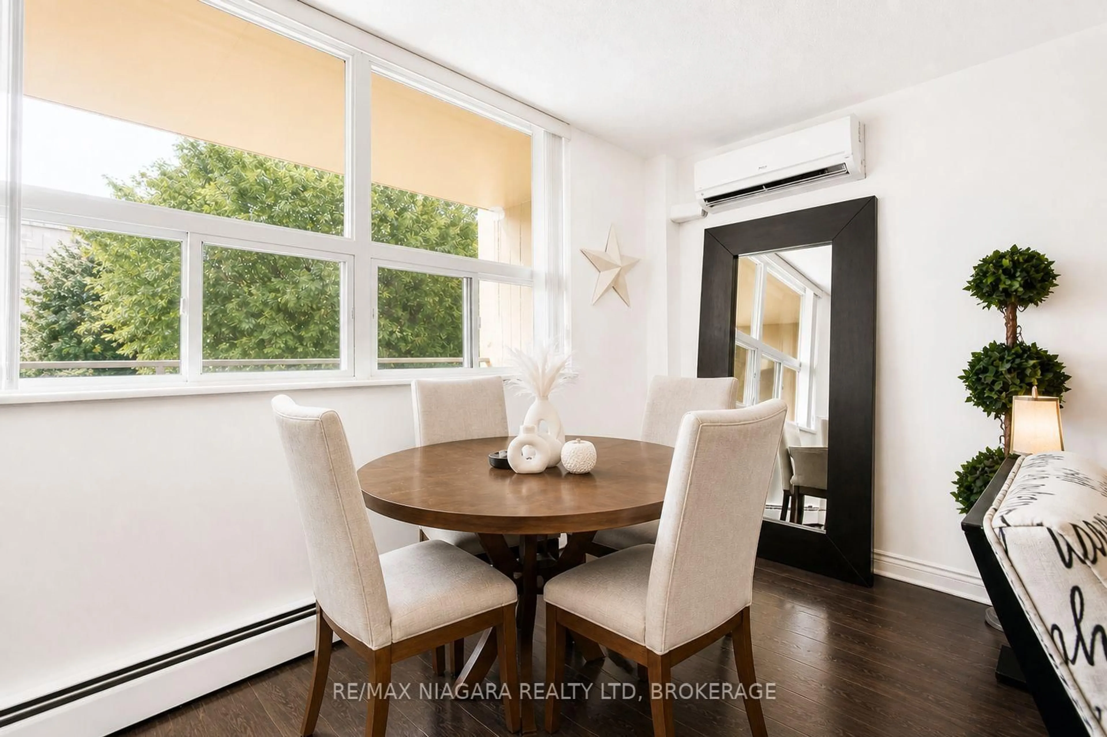Dining room, wood/laminate floor for 6390 Huggins St #205, Niagara Falls Ontario L2J 1H1