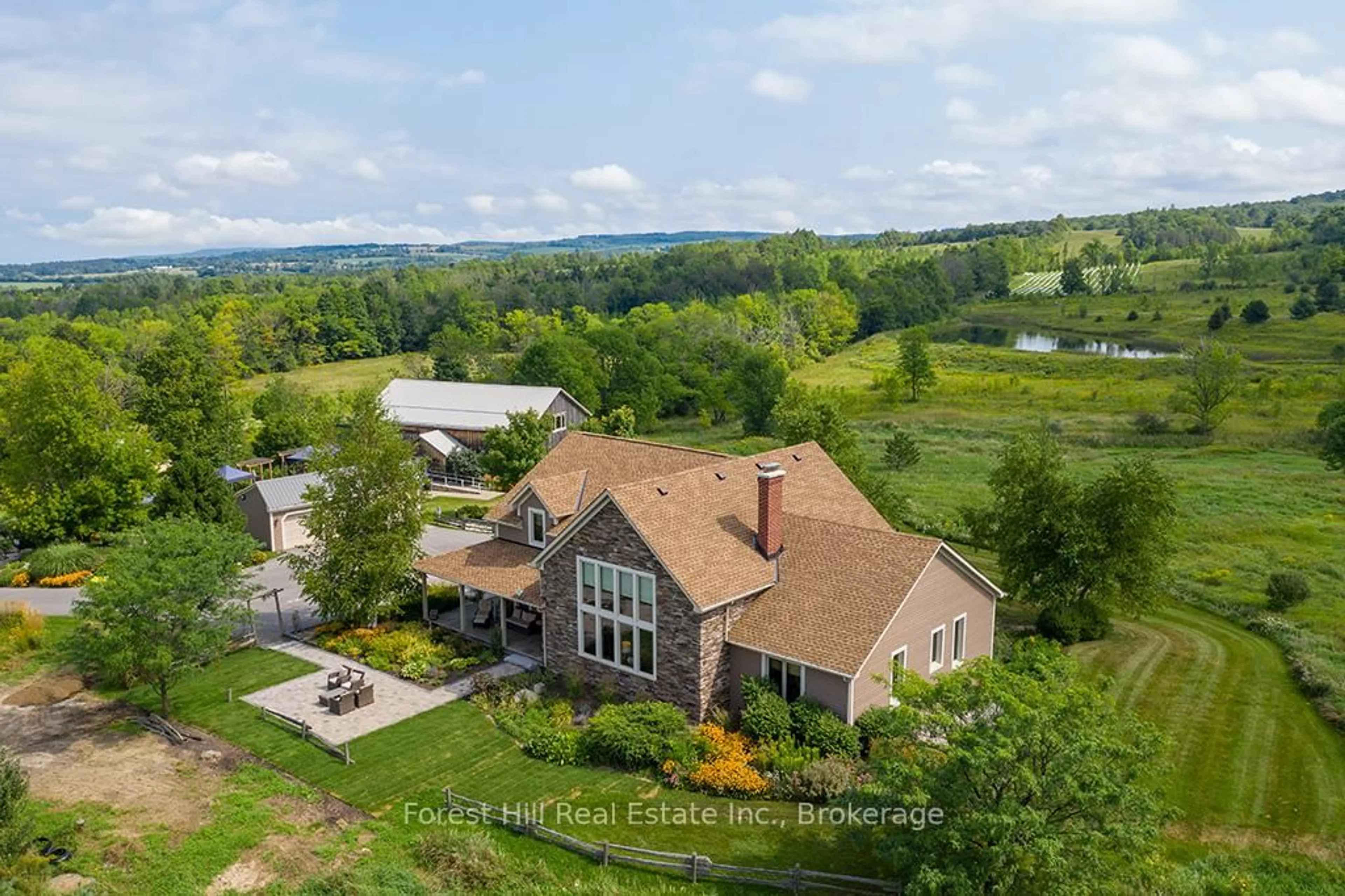 A pic from outside/outdoor area/front of a property/back of a property/a pic from drone, mountain view for 415763 10th Line, Blue Mountains Ontario N0H 1J0
