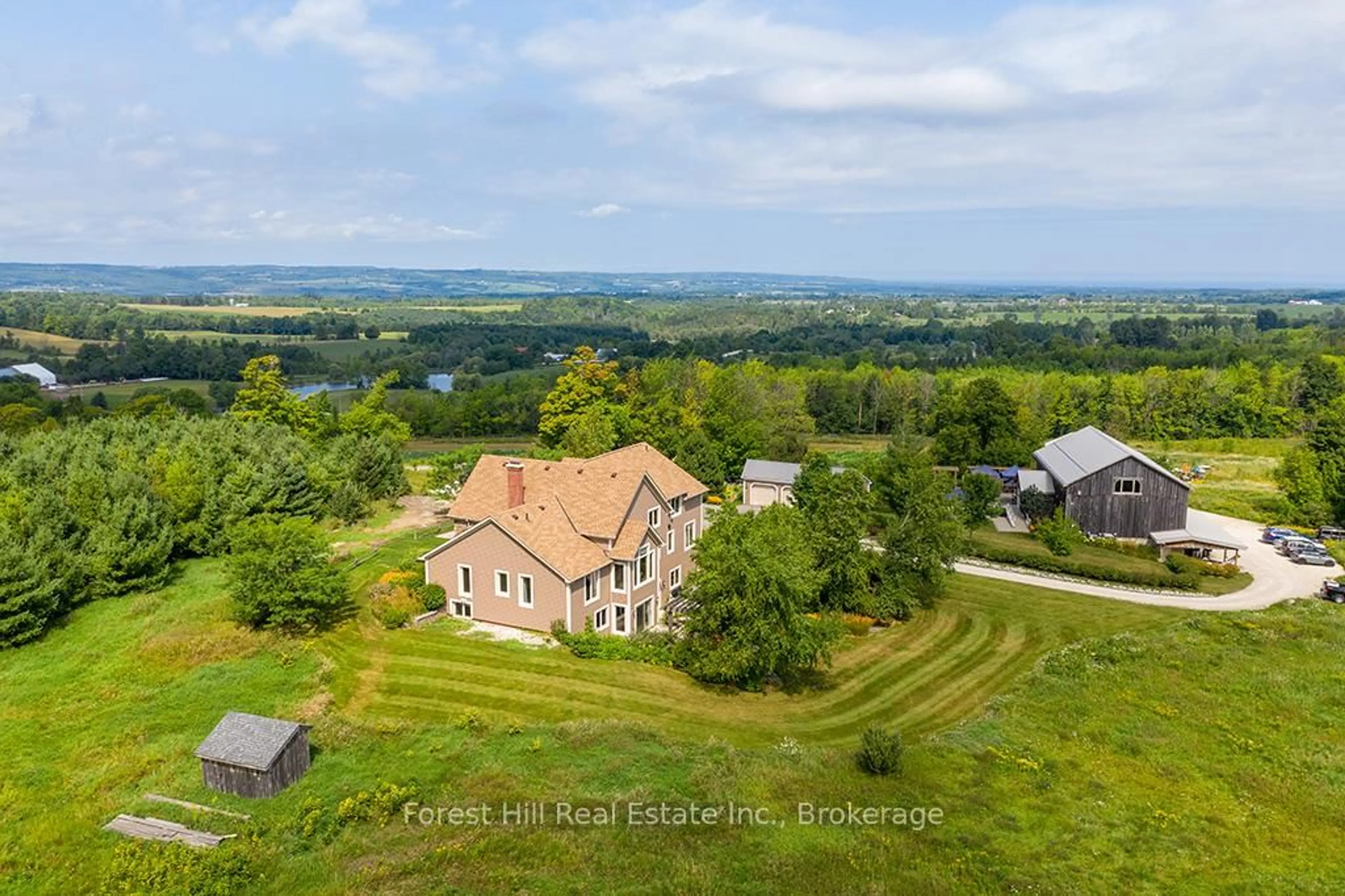 A pic from outside/outdoor area/front of a property/back of a property/a pic from drone, water/lake/river/ocean view for 415763 10th Line, Blue Mountains Ontario N0H 1J0