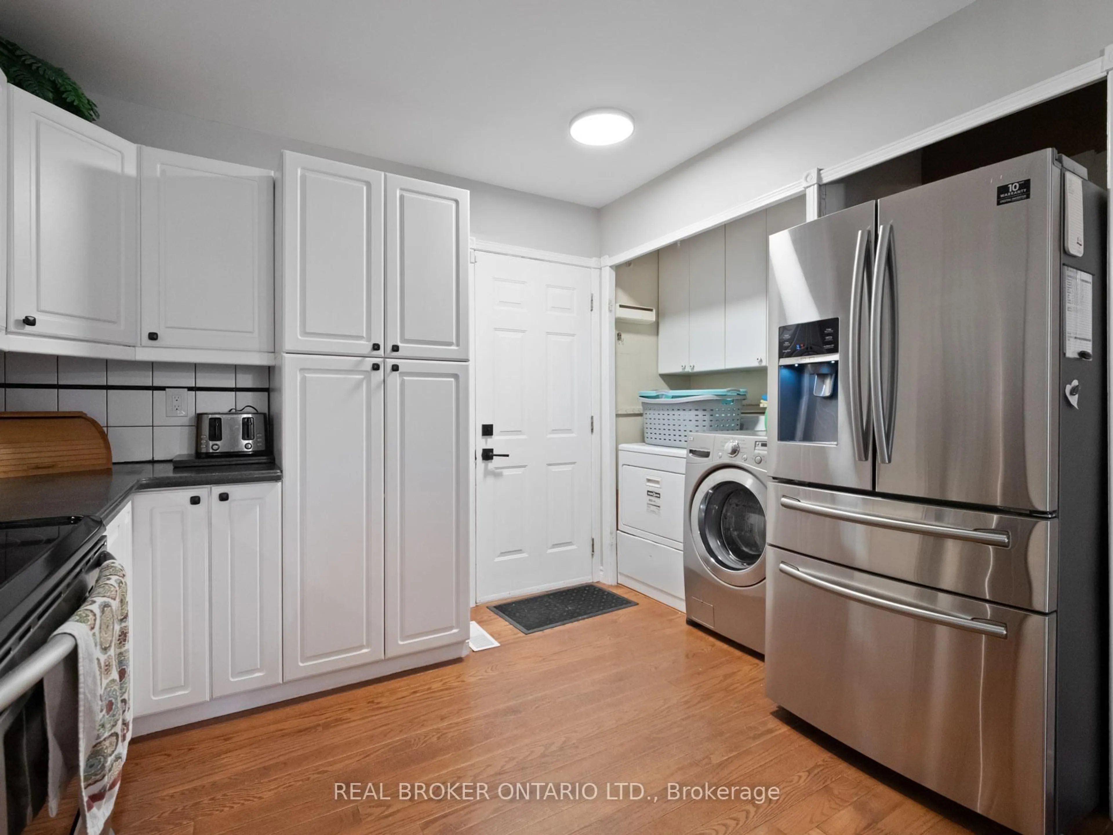Kitchen with laundary machines, unknown for 105 Calla Terr, Welland Ontario L3C 7C2
