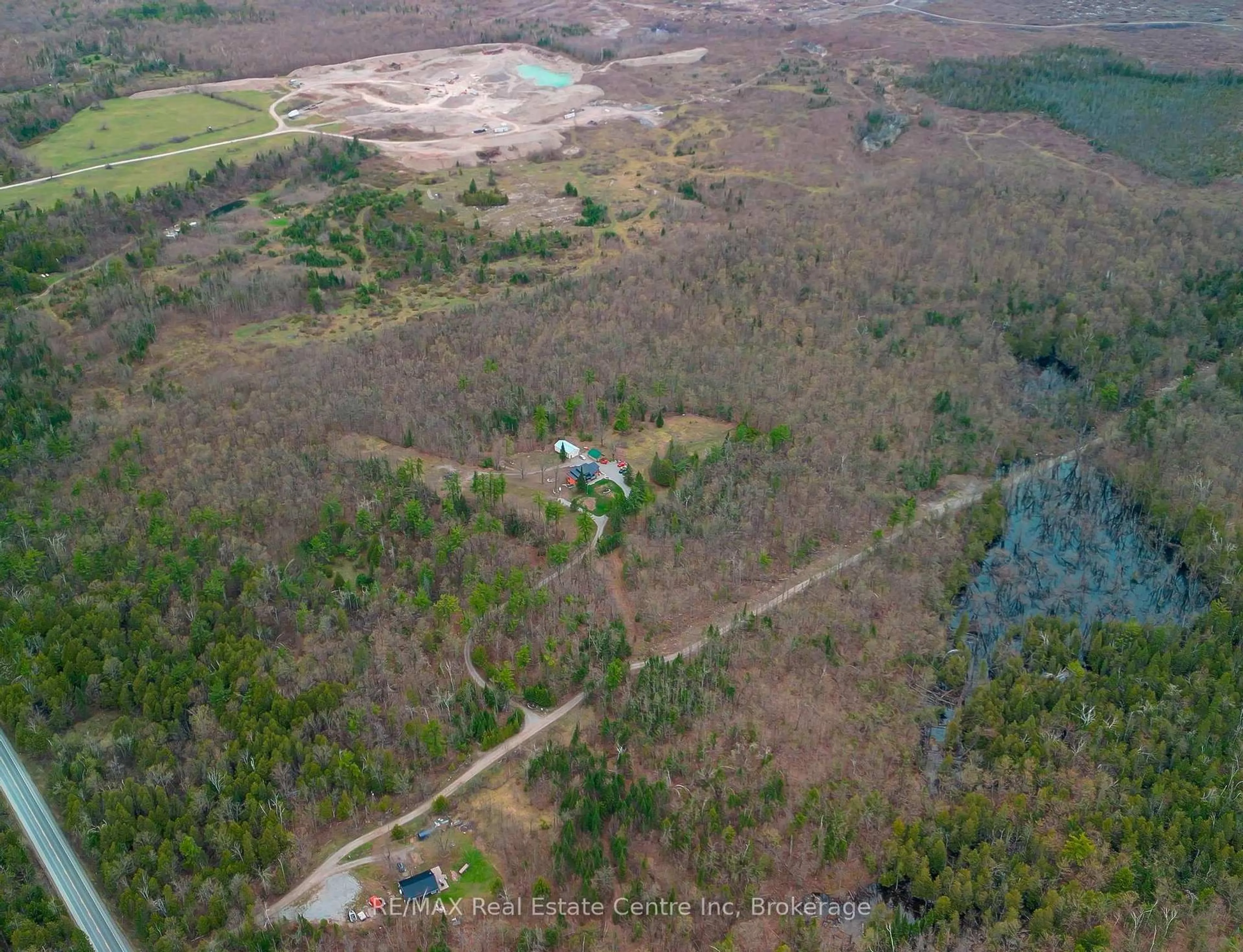 A pic from outside/outdoor area/front of a property/back of a property/a pic from drone, forest/trees view for 25 Fire Route 129, Trent Lakes Ontario K0M 1A0