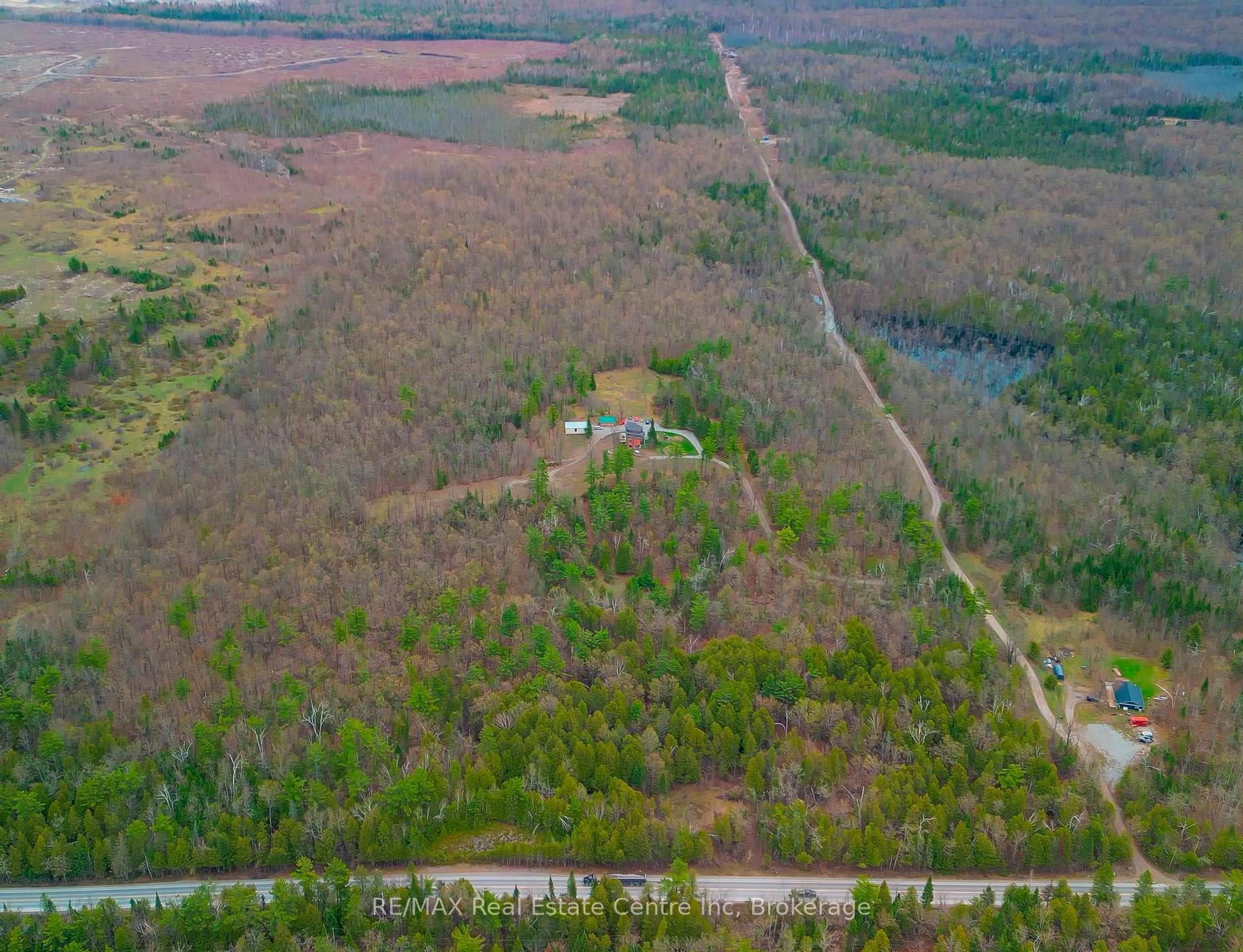 A pic from outside/outdoor area/front of a property/back of a property/a pic from drone, forest/trees view for 25 Fire Route 129, Trent Lakes Ontario K0M 1A0