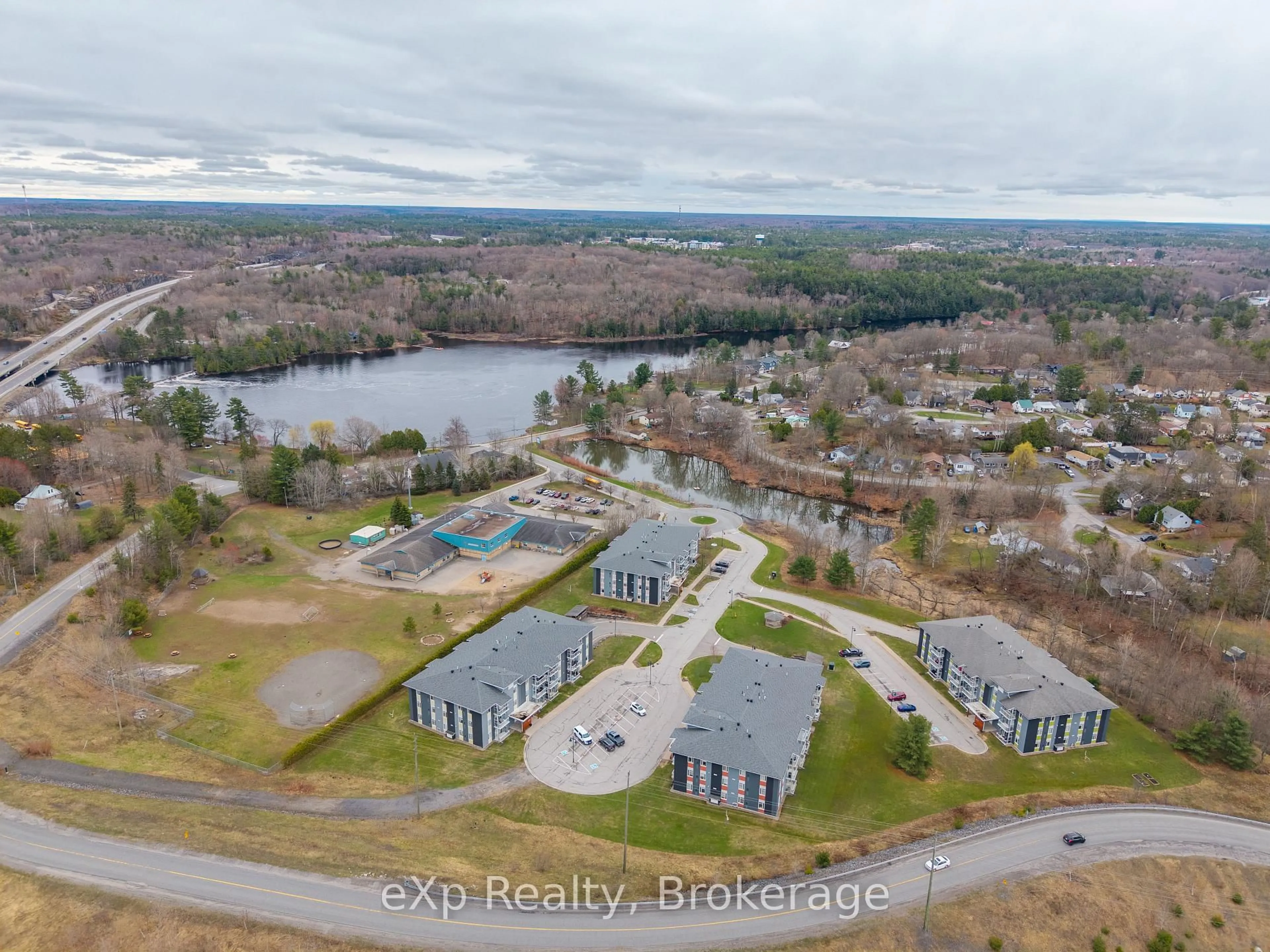 A pic from outside/outdoor area/front of a property/back of a property/a pic from drone, water/lake/river/ocean view for 20A Silver Birch Crt #302, Parry Sound Ontario P2A 0A7