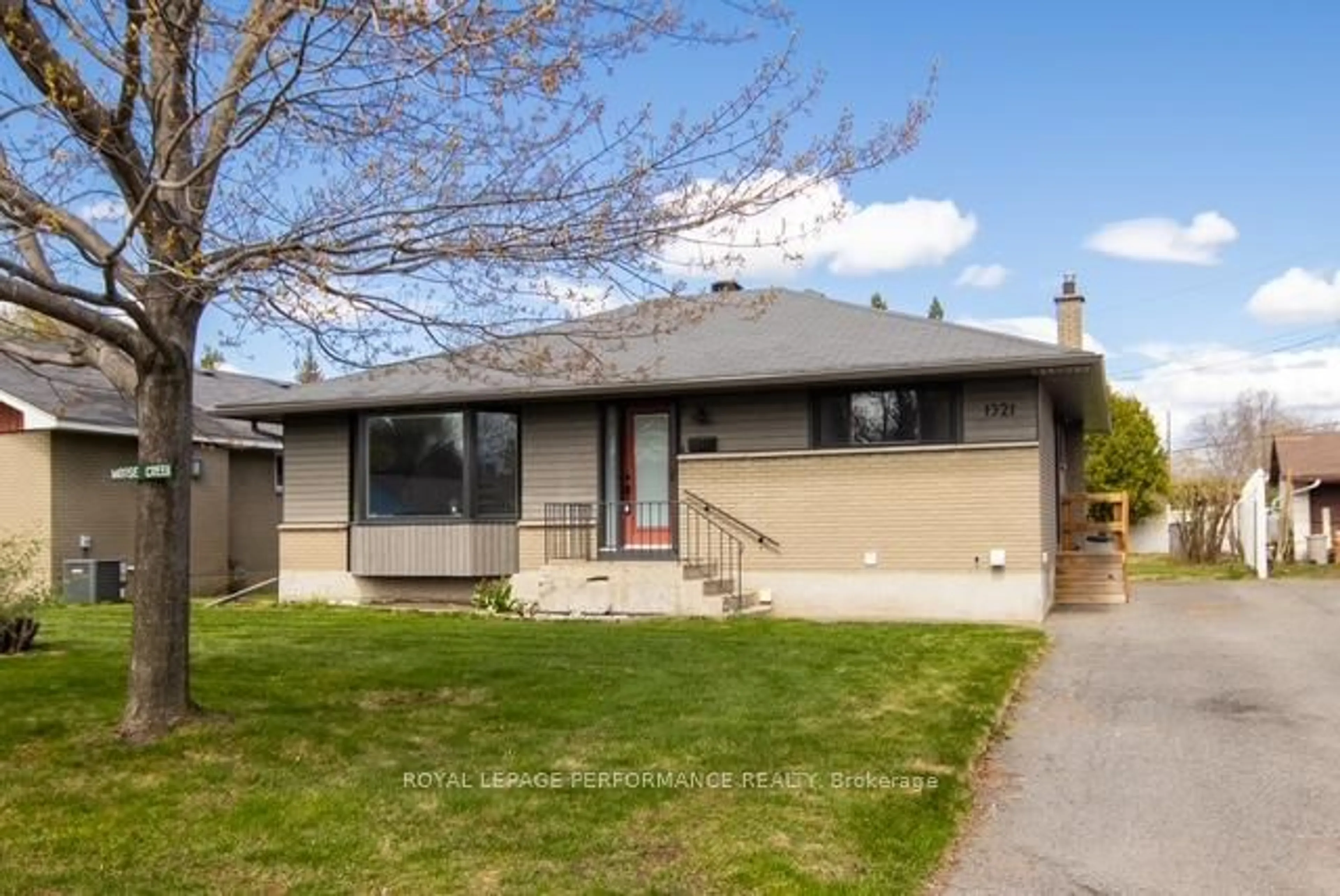 Home with vinyl exterior material, street for 1321 Rustic Dr, Ottawa Ontario K2C 2Y3
