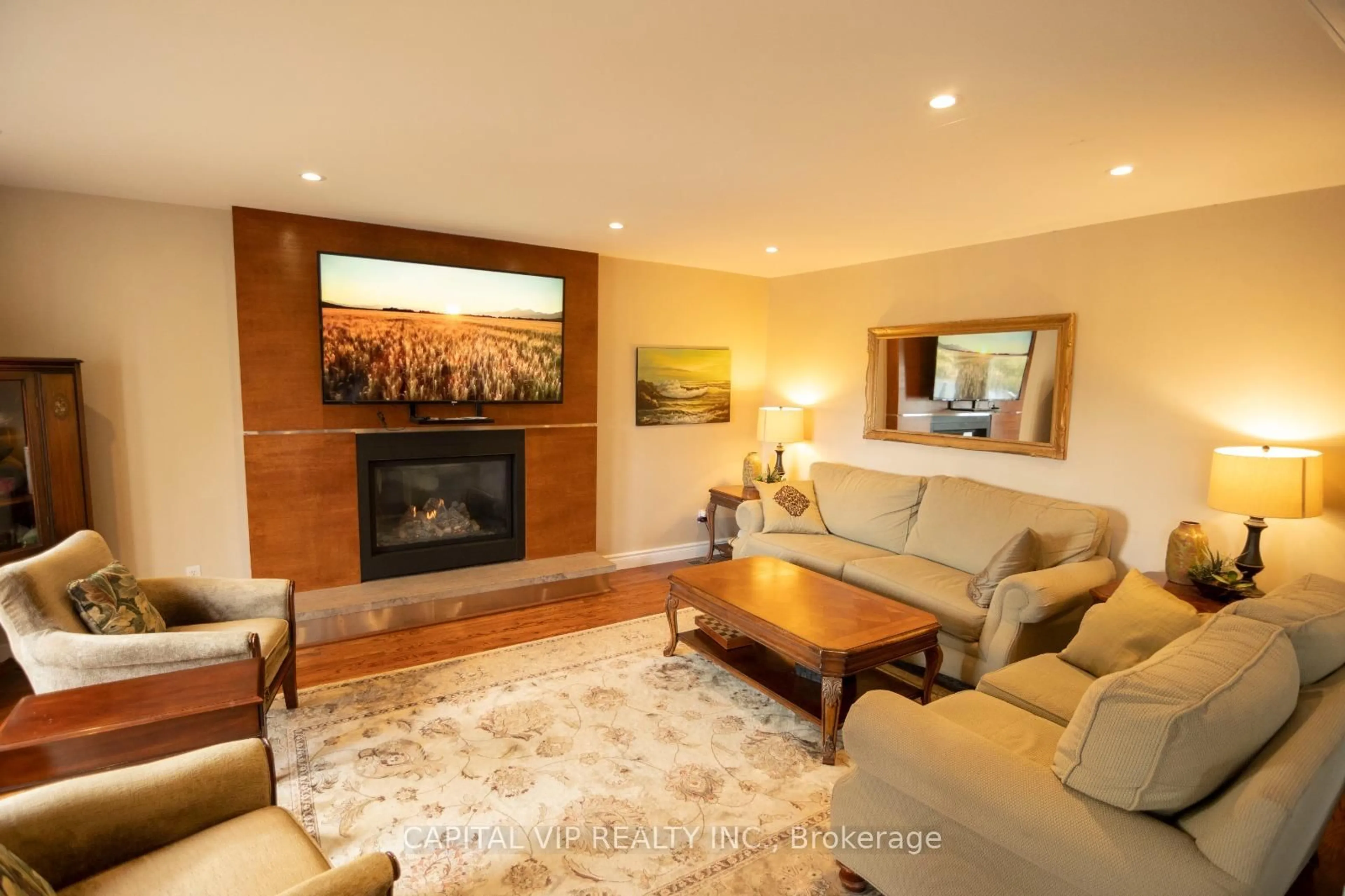 Living room with furniture, wood/laminate floor for 4 Wellsmere Crt, Ottawa Ontario K2E 8C2