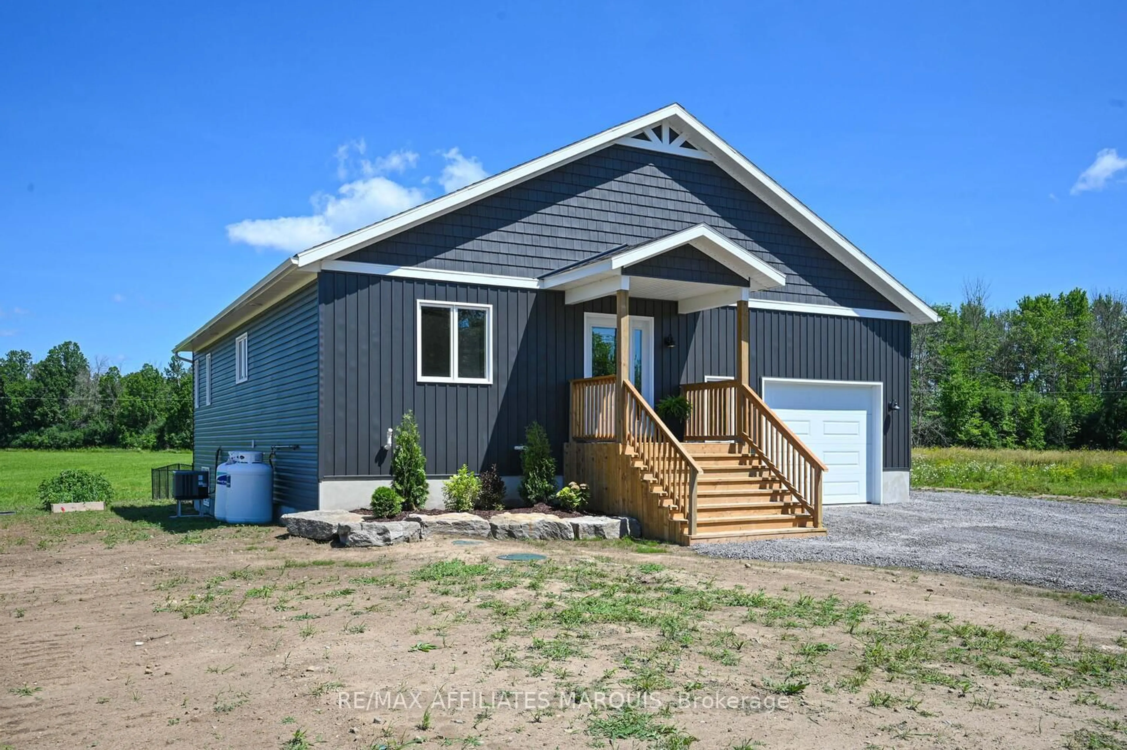 Home with vinyl exterior material, street for 1162 Rideau River Rd, Merrickville Ontario K0G 1N0
