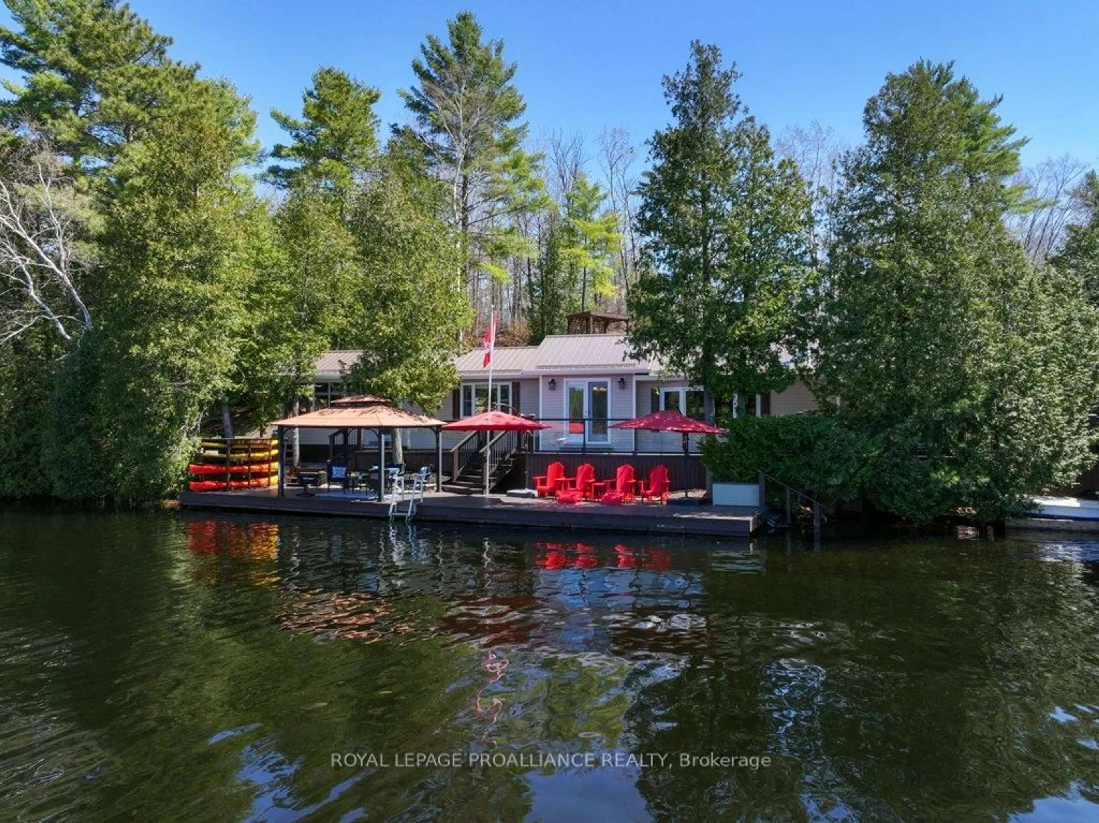 A pic from outside/outdoor area/front of a property/back of a property/a pic from drone, water/lake/river/ocean view for 1058 Shady Lane, Arden Ontario K0H 1B0