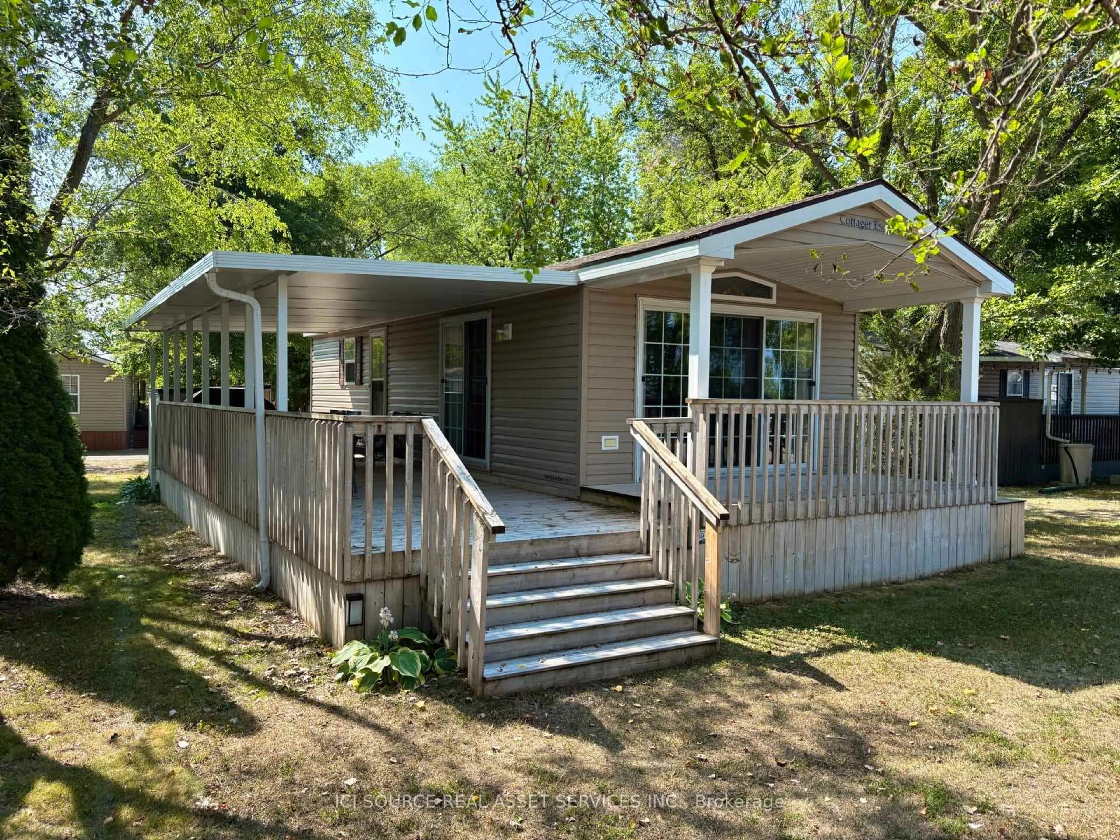 Home with vinyl exterior material, street for 486 County Road 18 #CBL039, Prince Edward County Ontario K0K 1P0