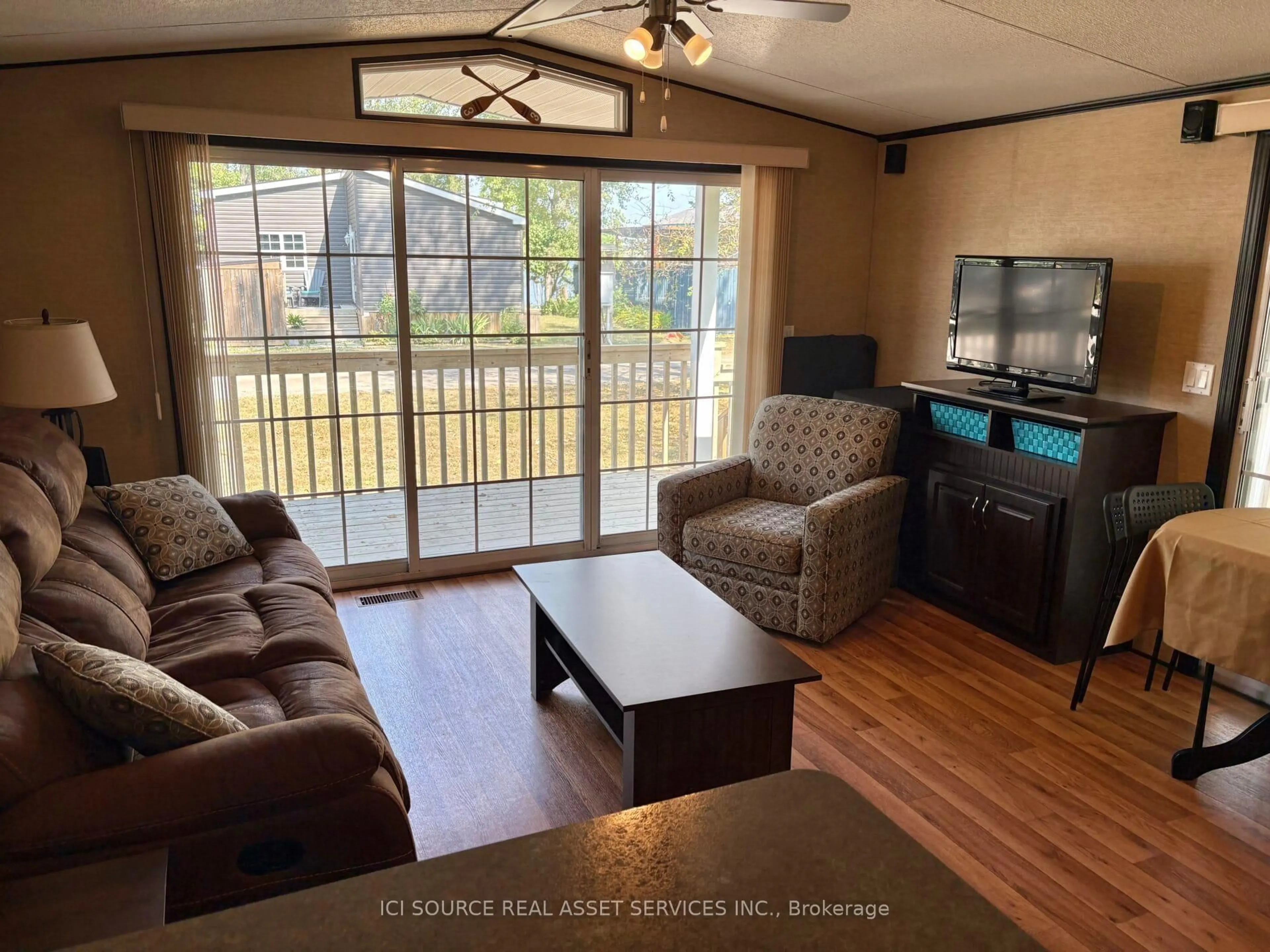 Living room with furniture, wood/laminate floor for 486 County Road 18 #CBL039, Prince Edward County Ontario K0K 1P0