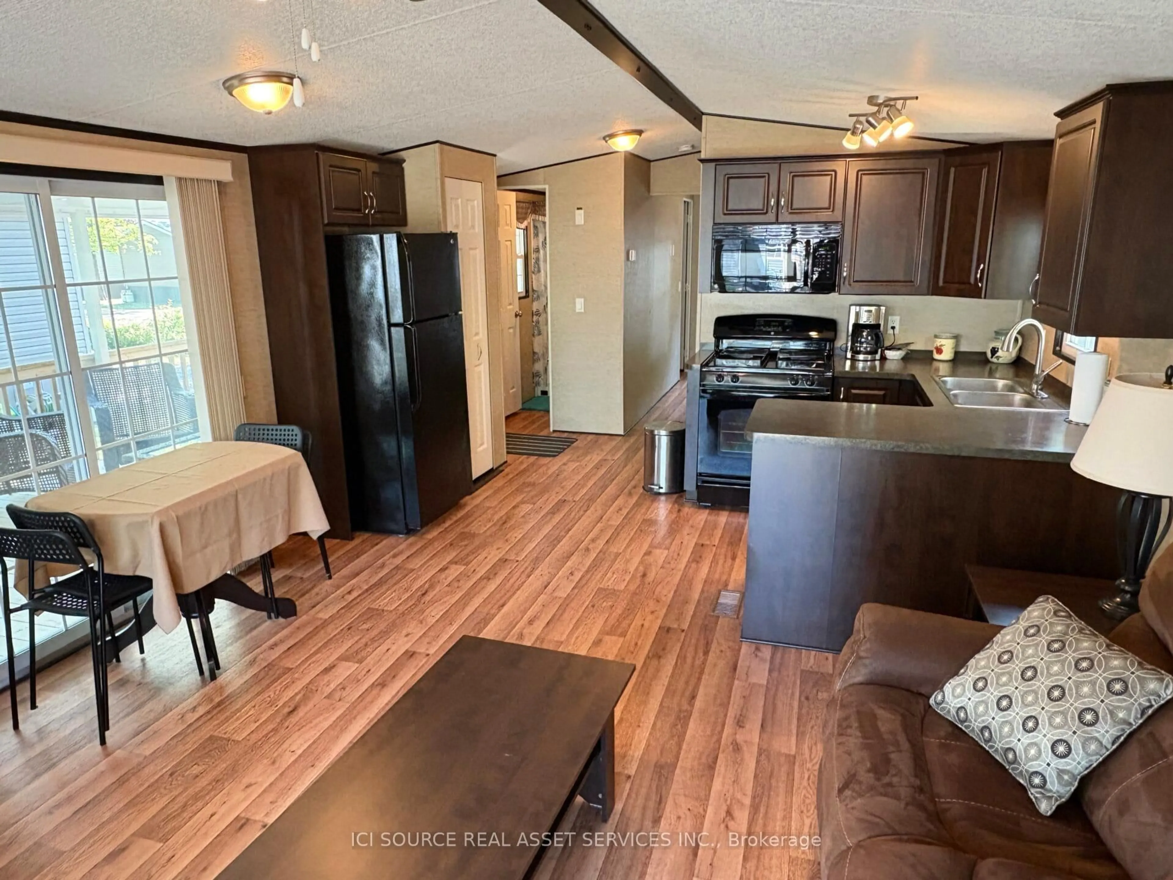 Open concept kitchen, wood/laminate floor for 486 County Road 18 #CBL039, Prince Edward County Ontario K0K 1P0