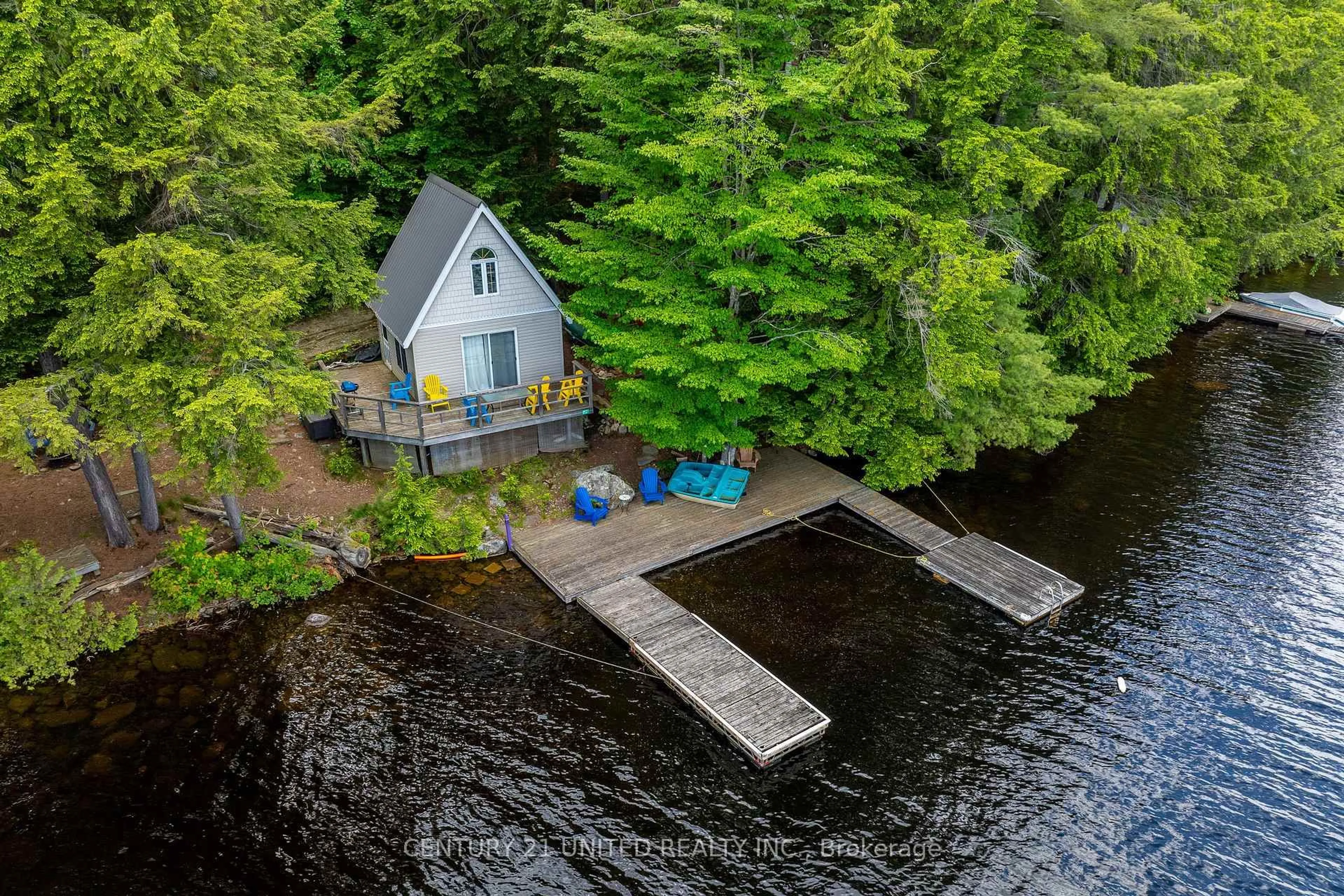A pic from outside/outdoor area/front of a property/back of a property/a pic from drone, water/lake/river/ocean view for 852 Isl 8 Catchacoma Lake Island, Trent Lakes Ontario K0L 1J0
