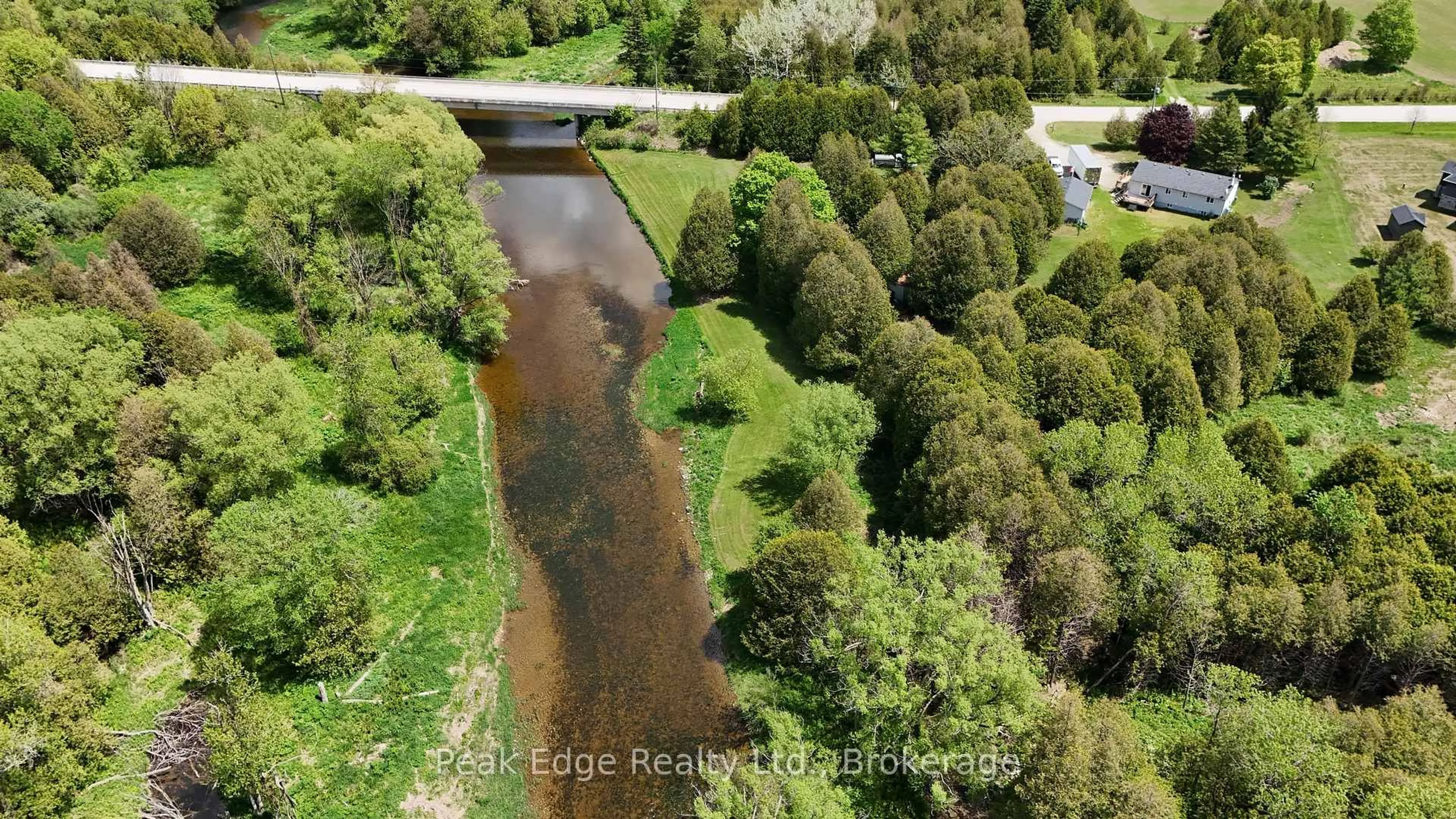 A pic from outside/outdoor area/front of a property/back of a property/a pic from drone, water/lake/river/ocean view for 9840 Baseline Rd, Minto Ontario N0G 1M0