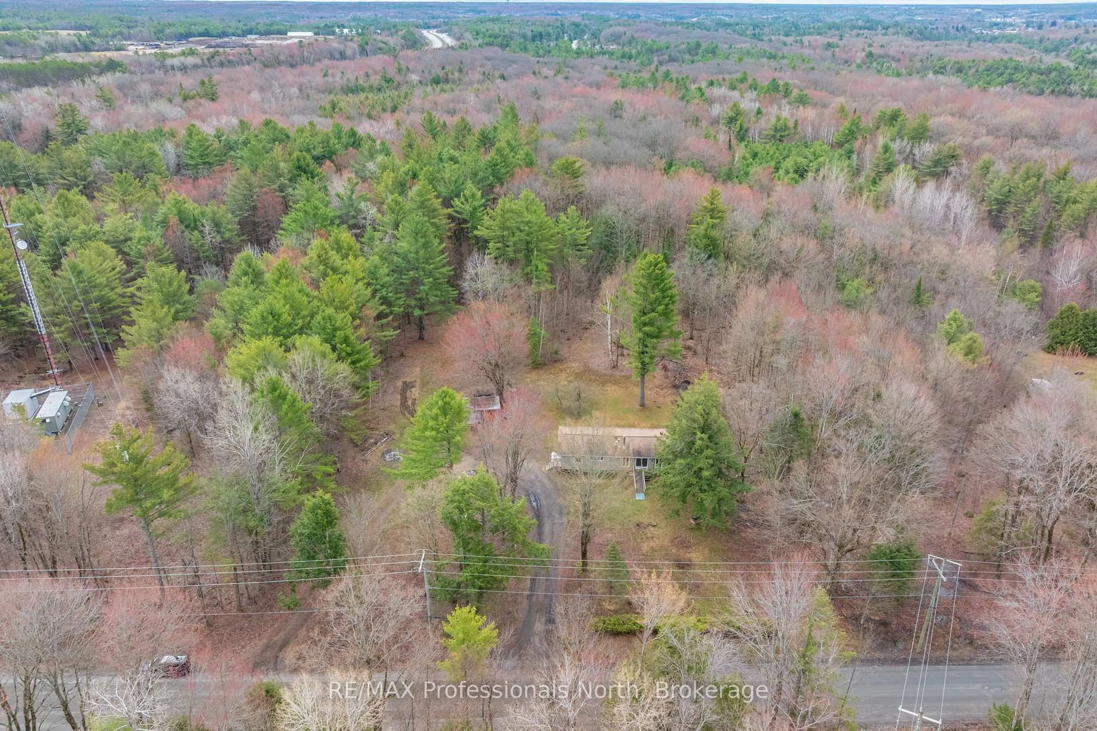 A pic from outside/outdoor area/front of a property/back of a property/a pic from drone, forest/trees view for 1056 Kirk Line, Bracebridge Ontario P1L 1W9