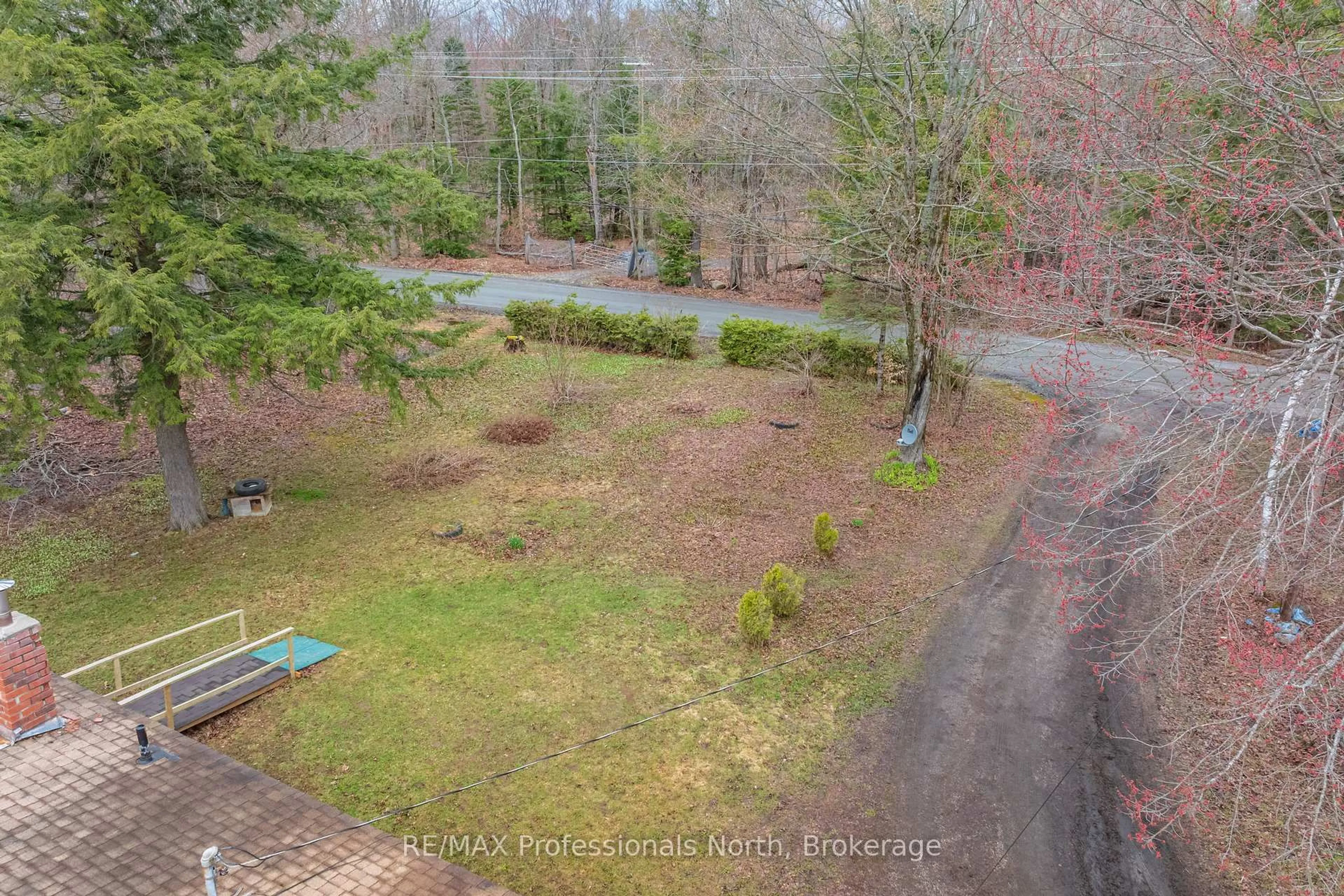 A pic from outside/outdoor area/front of a property/back of a property/a pic from drone, forest/trees view for 1056 Kirk Line, Bracebridge Ontario P1L 1W9