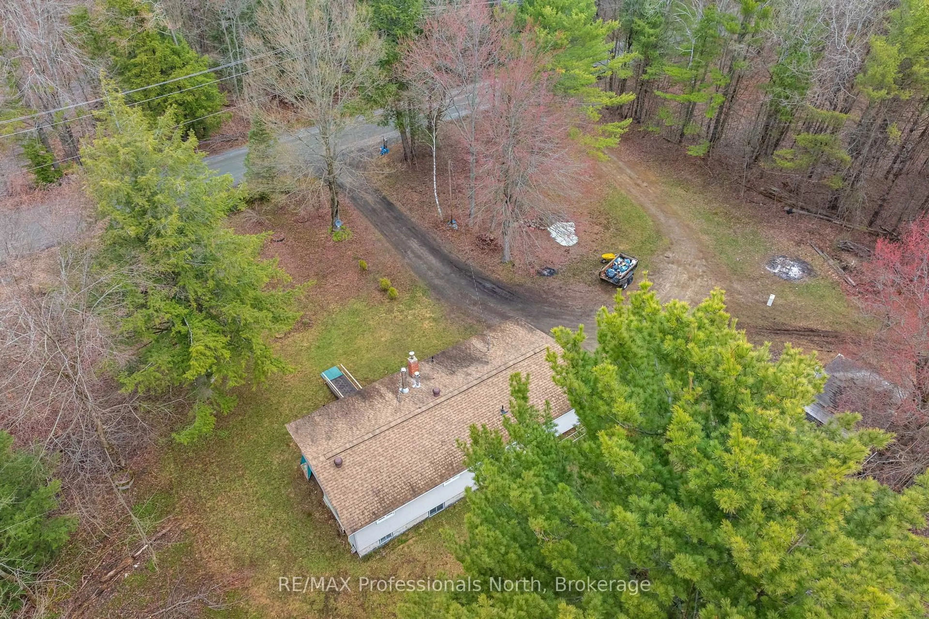 A pic from outside/outdoor area/front of a property/back of a property/a pic from drone, forest/trees view for 1056 Kirk Line, Bracebridge Ontario P1L 1W9