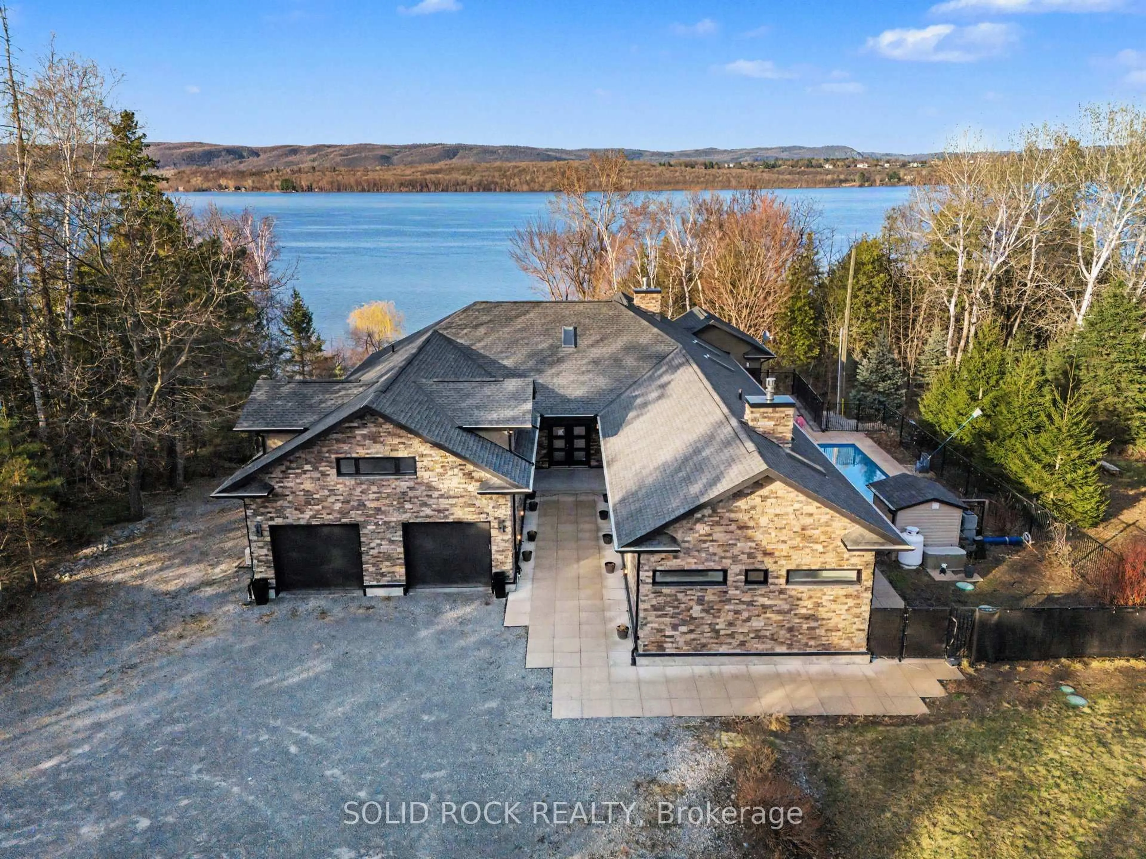 A pic from outside/outdoor area/front of a property/back of a property/a pic from drone, water/lake/river/ocean view for 19 Neely St, Ottawa Ontario K0A 1T0