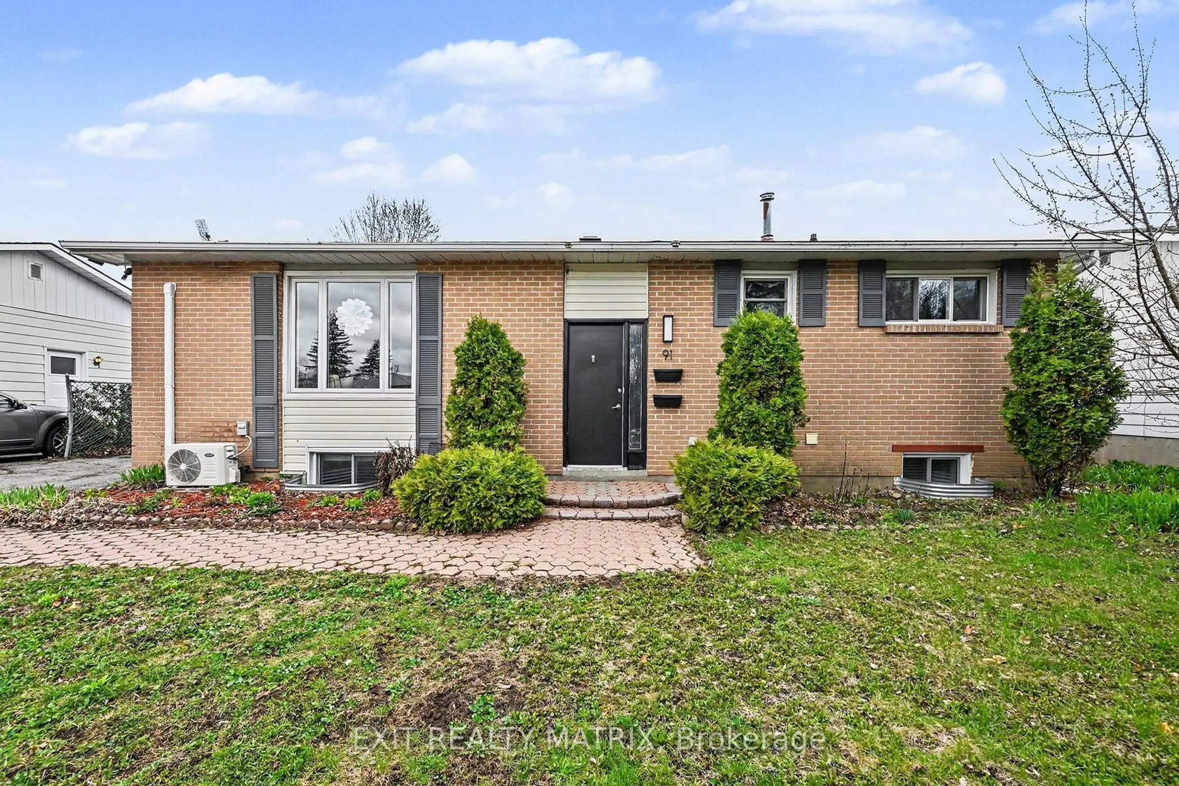Home with brick exterior material, street for 91 Sheldrake Dr, Ottawa Ontario K2L 1T1