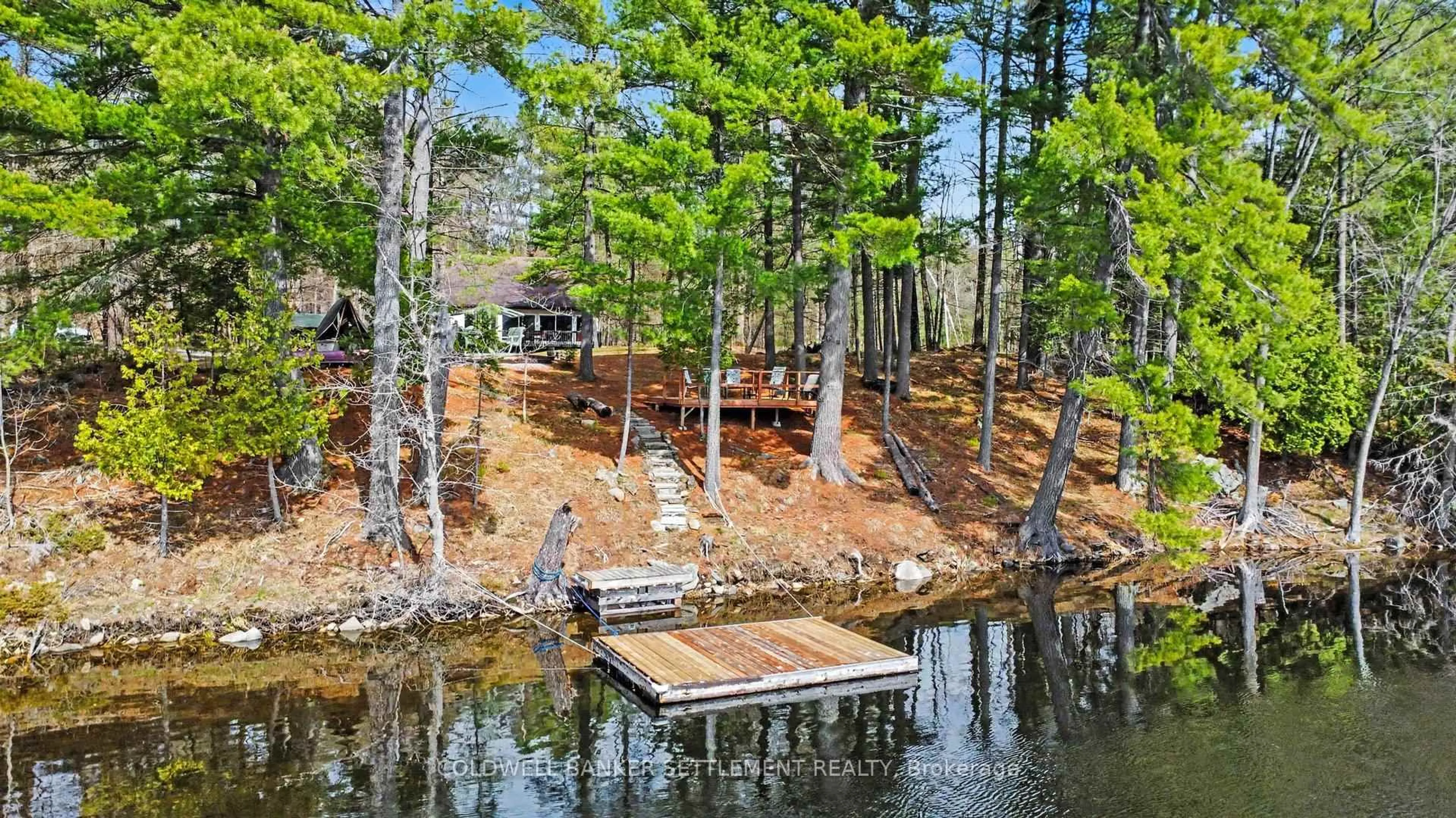 A pic from outside/outdoor area/front of a property/back of a property/a pic from drone, water/lake/river/ocean view for 205 Scott Crt, Maberly Ontario K0H 2B0