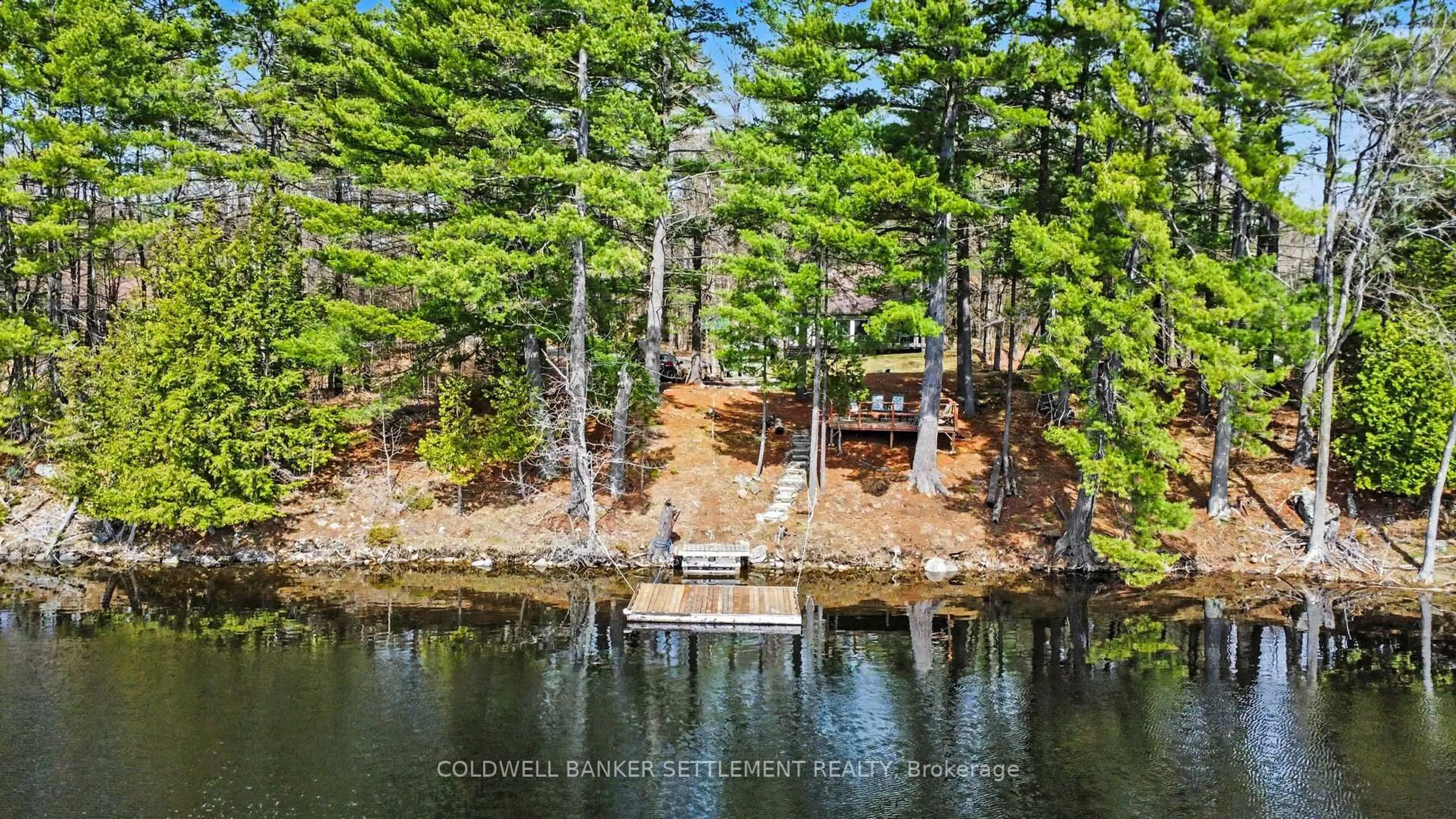 A pic from outside/outdoor area/front of a property/back of a property/a pic from drone, water/lake/river/ocean view for 205 Scott Crt, Maberly Ontario K0H 2B0