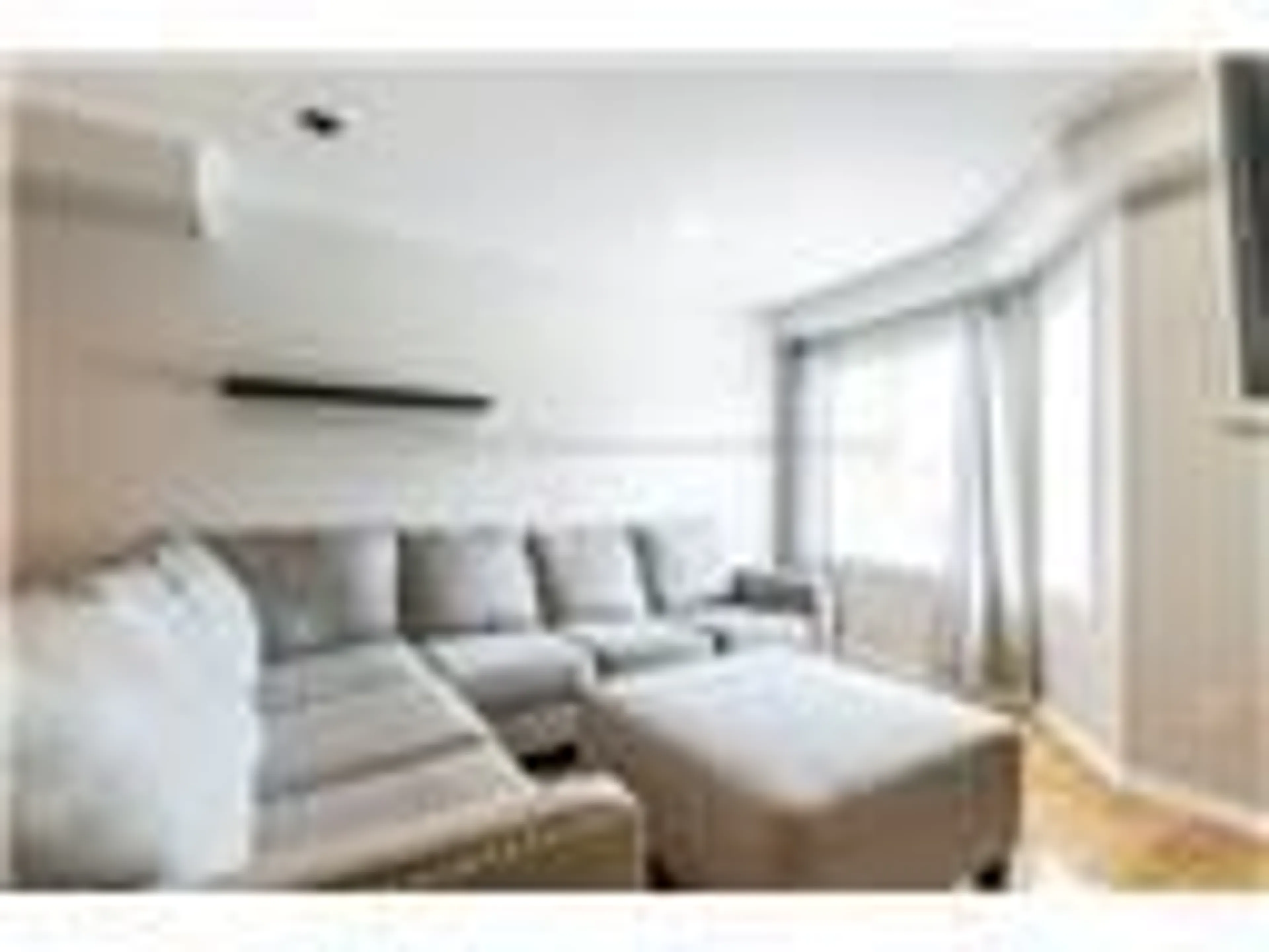 Living room with furniture, wood/laminate floor for 470 Beach Blvd #8, Hamilton Ontario L8H 6X2