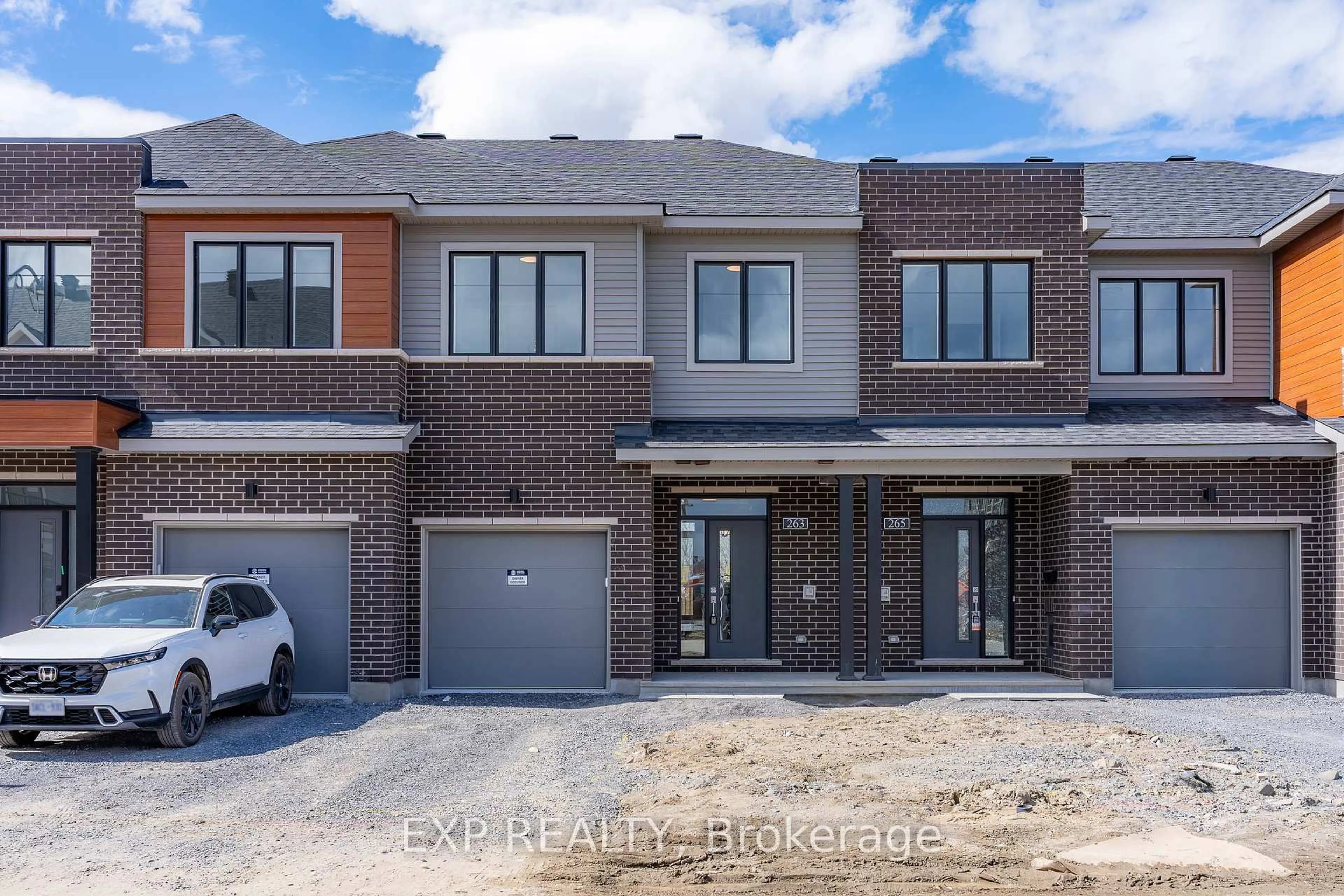 Home with brick exterior material, street for 263 Bankside Way, Barrhaven Ontario K2J 7M8