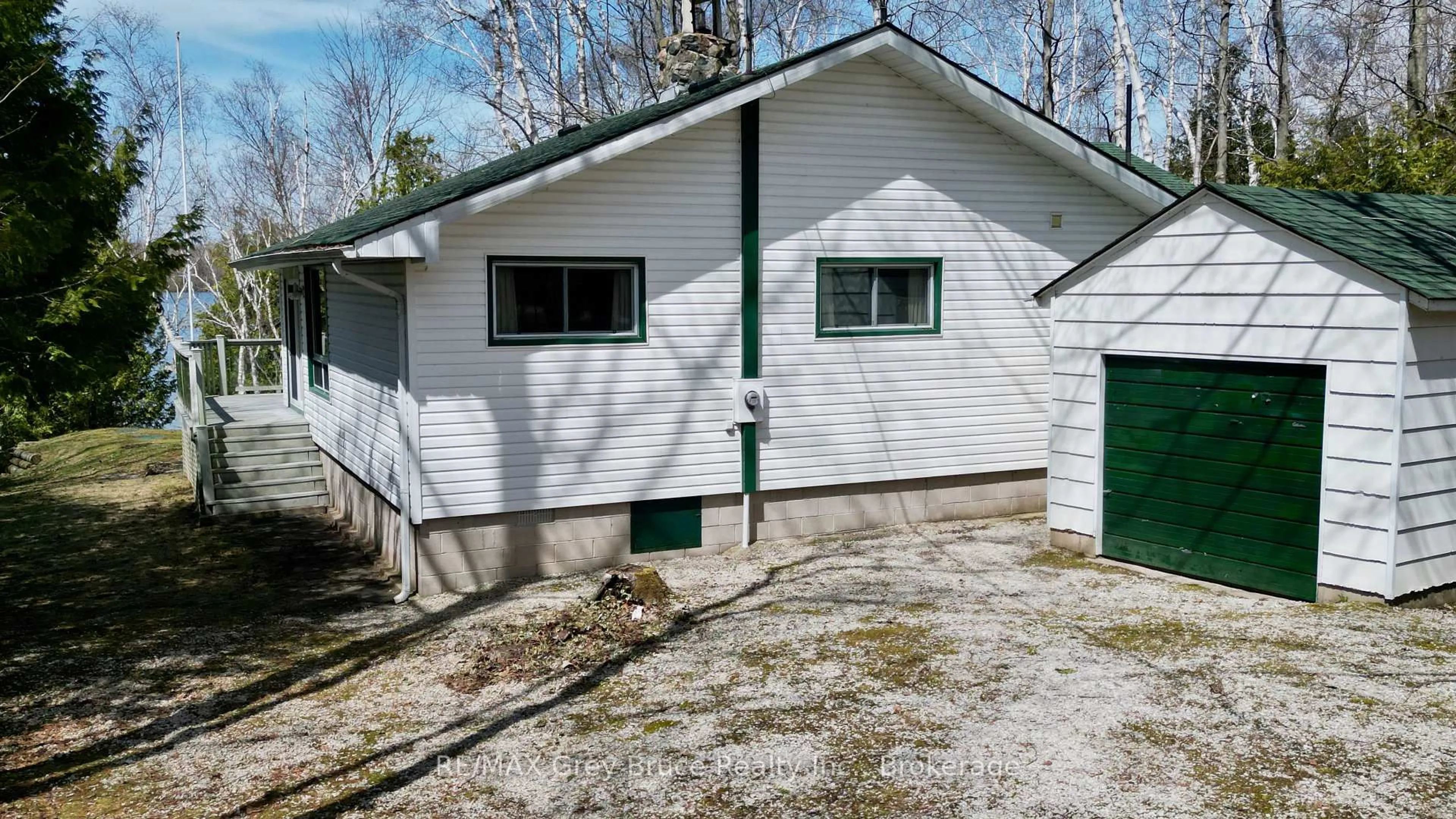 Home with vinyl exterior material, street for 294 Tammy's Cove Rd, Northern Bruce Peninsula Ontario N0H 1W0