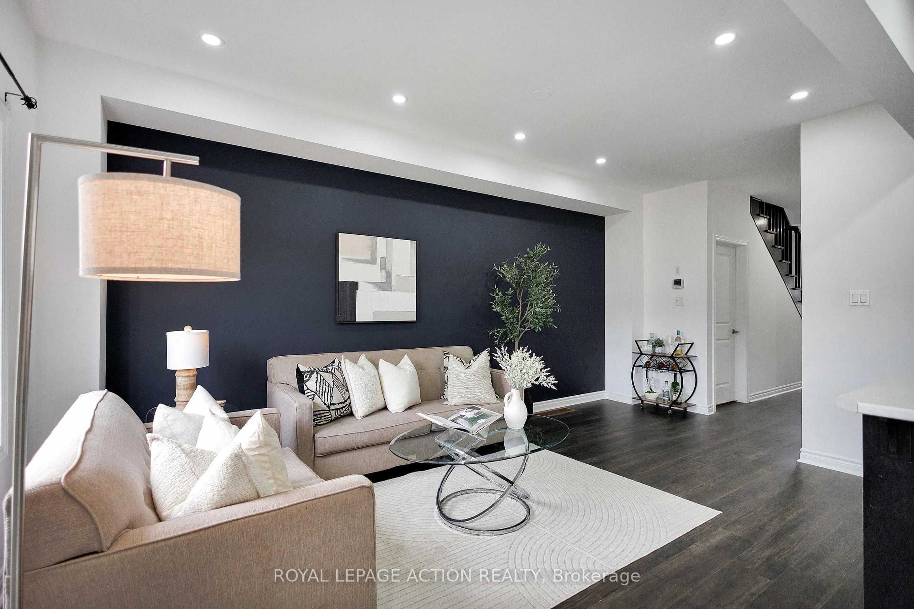 Living room with furniture, wood/laminate floor for 35 Bilanski Farm Rd, Brantford Ontario N3S 0J7