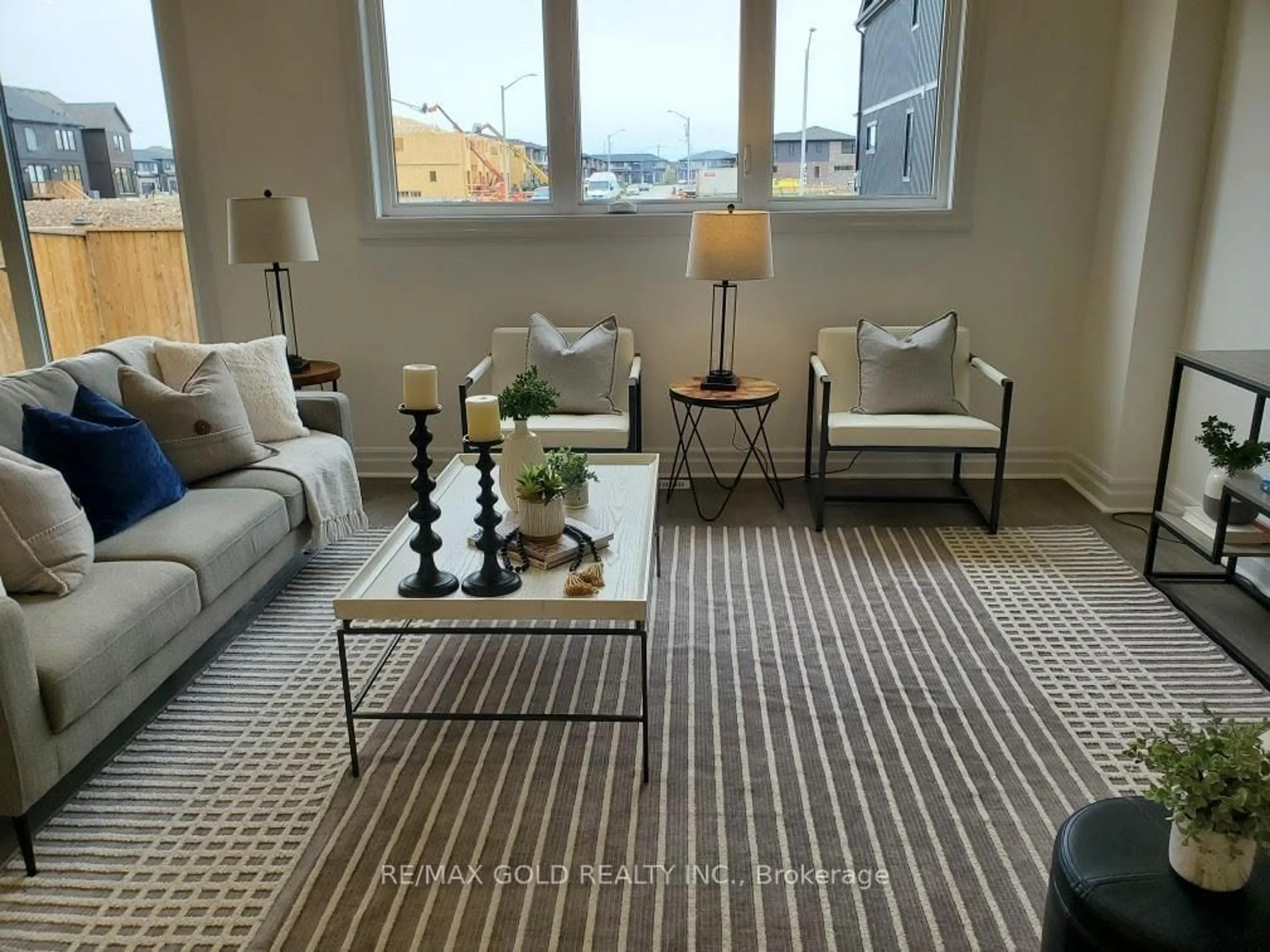 Living room with furniture, carpet floor for 7507 Splendour Dr, Niagara Falls Ontario L2H 2Y6
