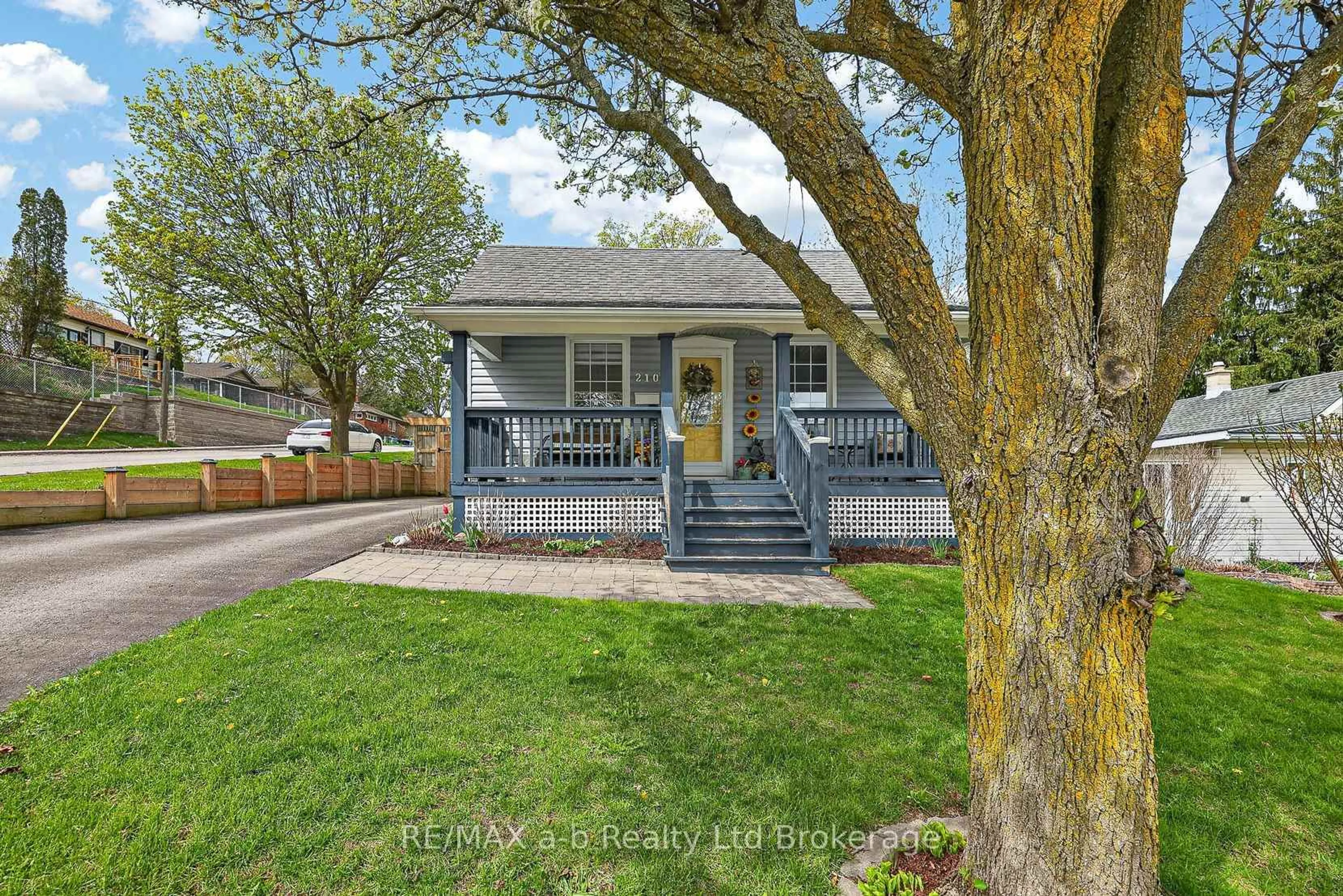 Home with vinyl exterior material, street for 210 Russell St, Woodstock Ontario N4S 2Z2