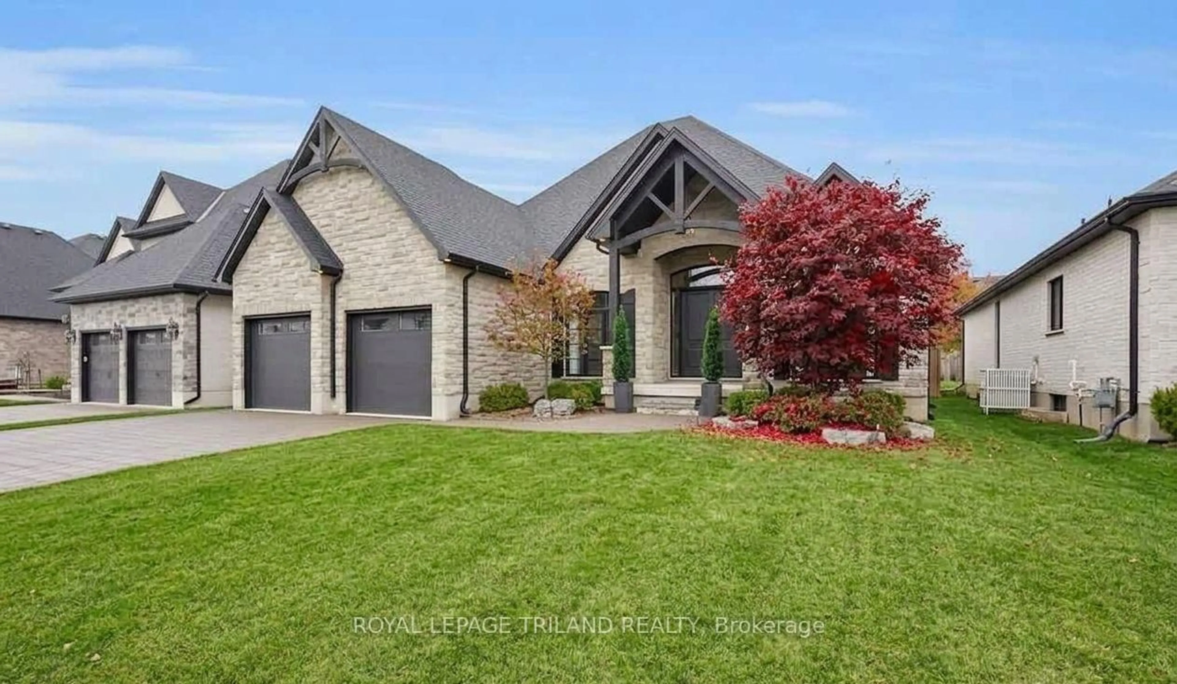 Home with brick exterior material, street for 9861 GLENDON Dr #218, Middlesex Centre Ontario N0L 1R0