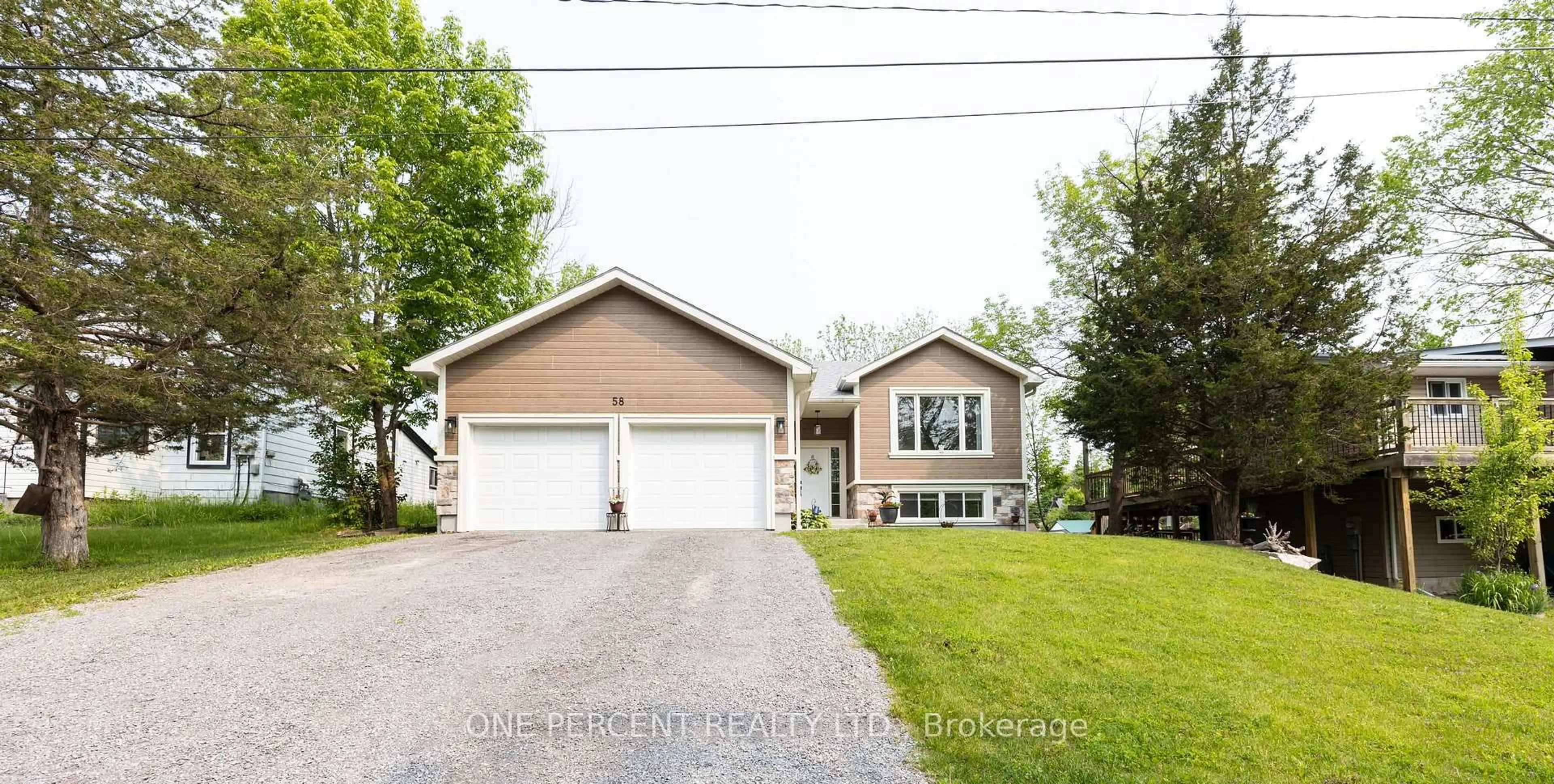 Home with vinyl exterior material, street for 58 McKenzie St, Madoc Ontario K0K 2K0