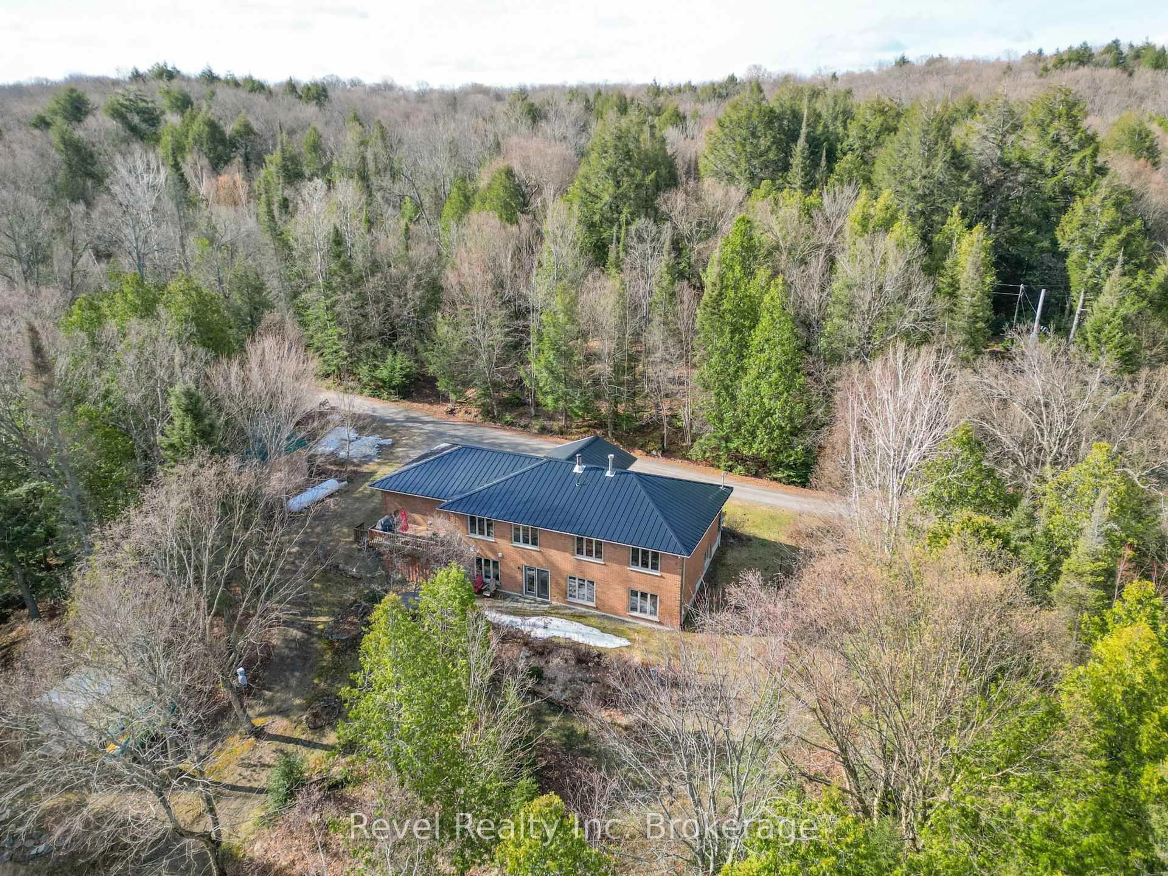 A pic from outside/outdoor area/front of a property/back of a property/a pic from drone, forest/trees view for 170K Shorewood Rd, North Bay Ontario P1B 8G4