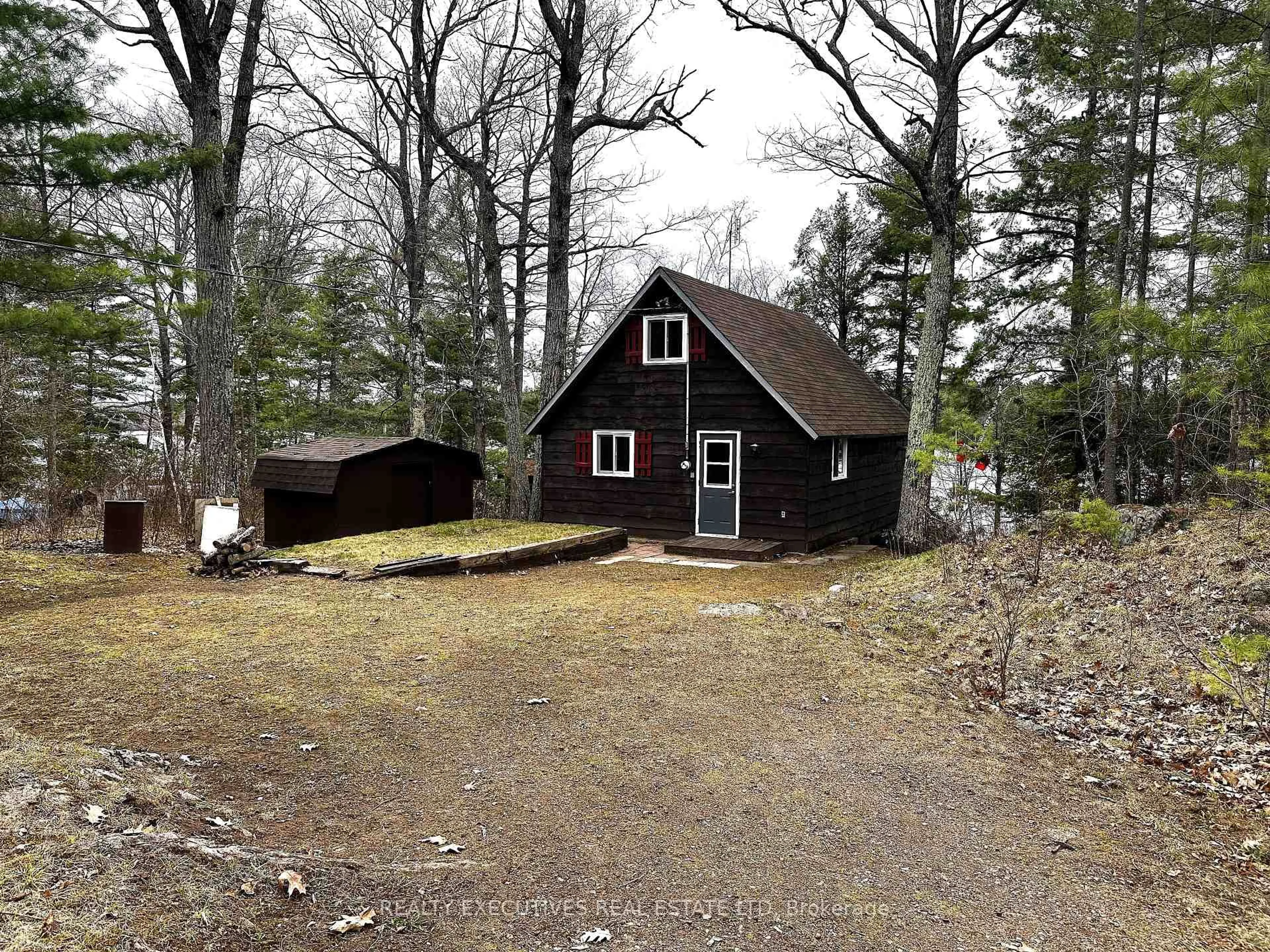 A pic from outside/outdoor area/front of a property/back of a property/a pic from drone, forest/trees view for 210 Birch Bay Lane, Maberly Ontario K0H 2B0