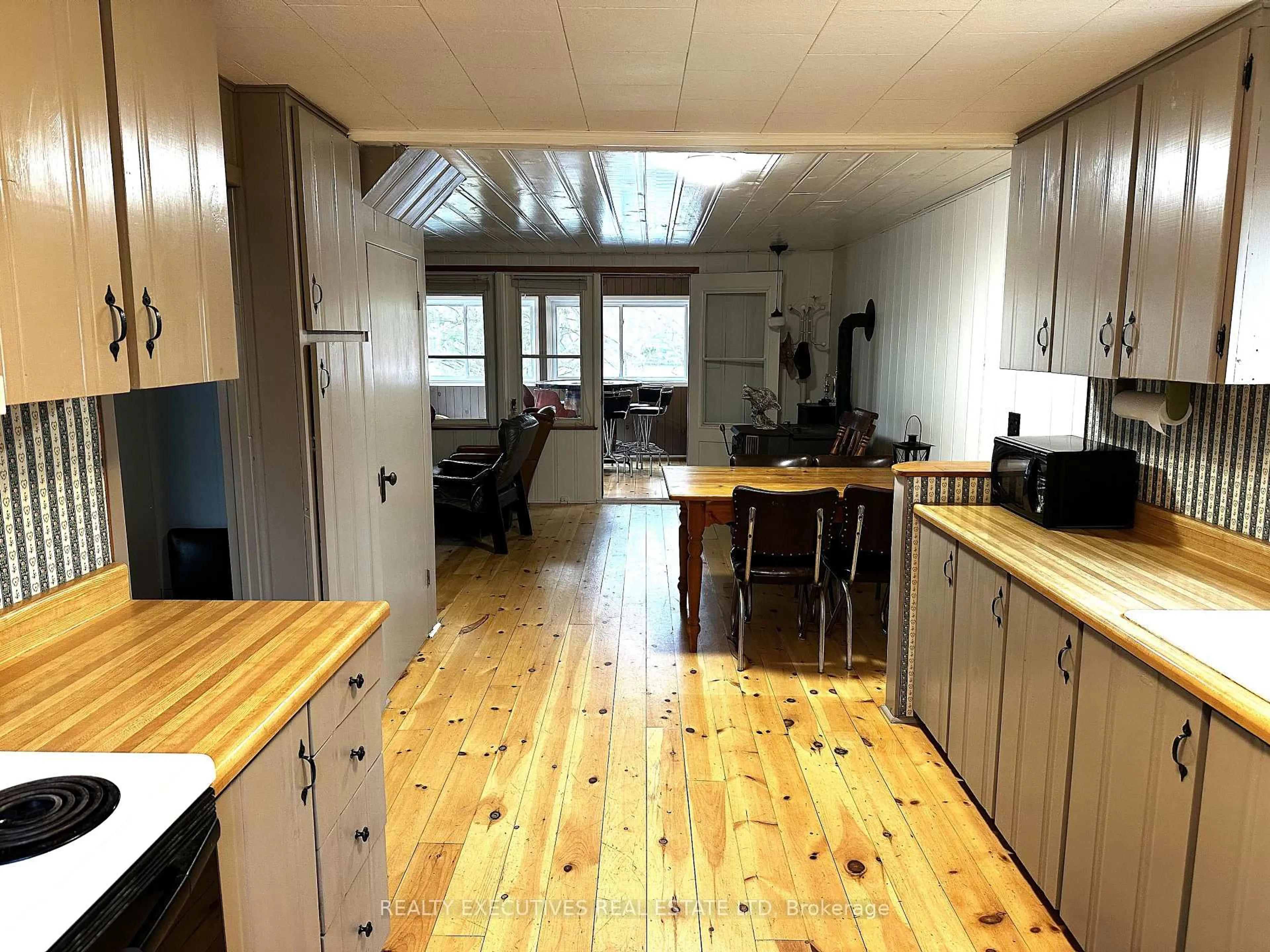 Open concept kitchen, wood/laminate floor for 210 Birch Bay Lane, Maberly Ontario K0H 2B0