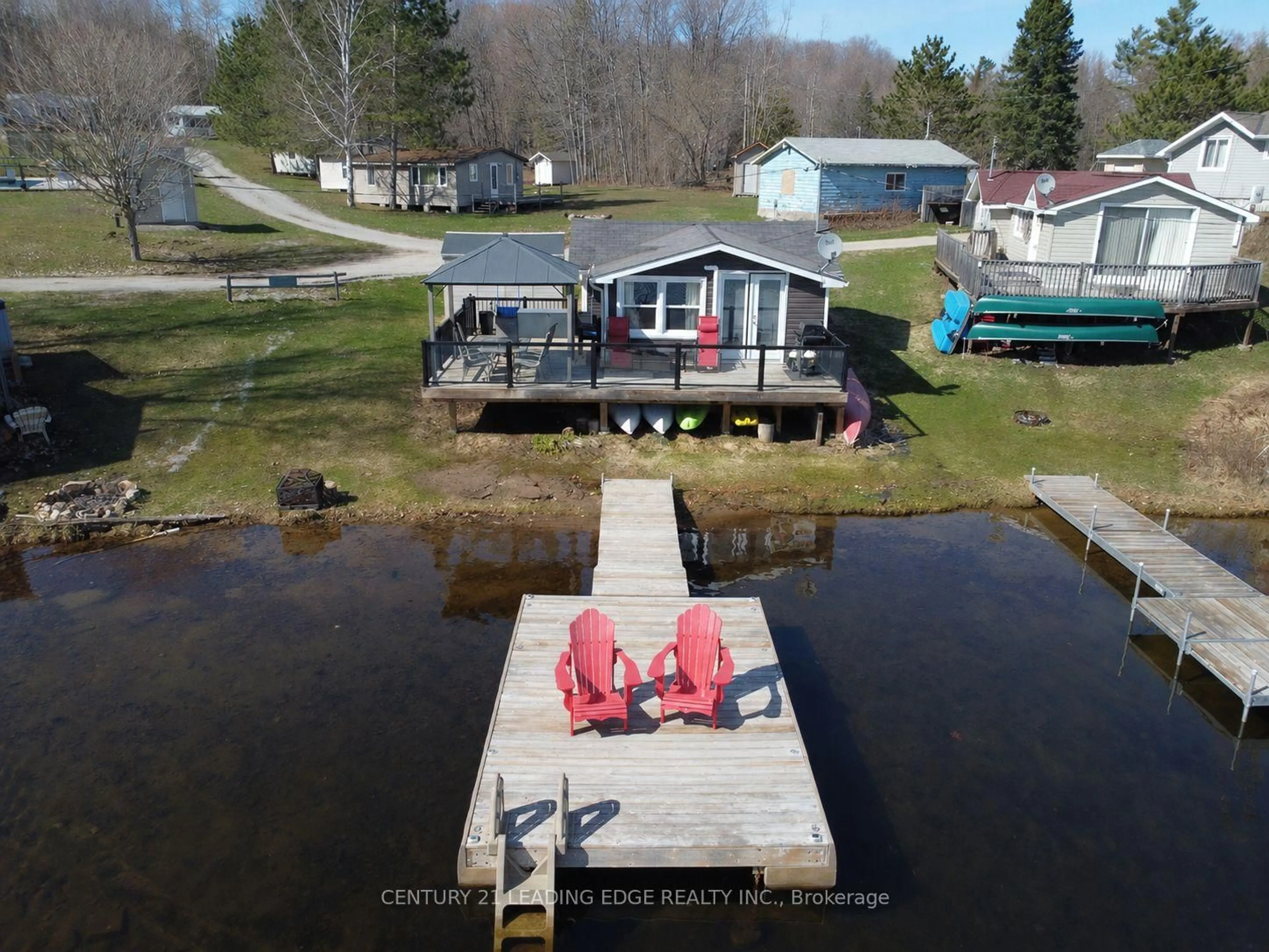 A pic from outside/outdoor area/front of a property/back of a property/a pic from drone, water/lake/river/ocean view for 1043 Lobo Dr #24, Minden Hills Ontario K0M 2K0