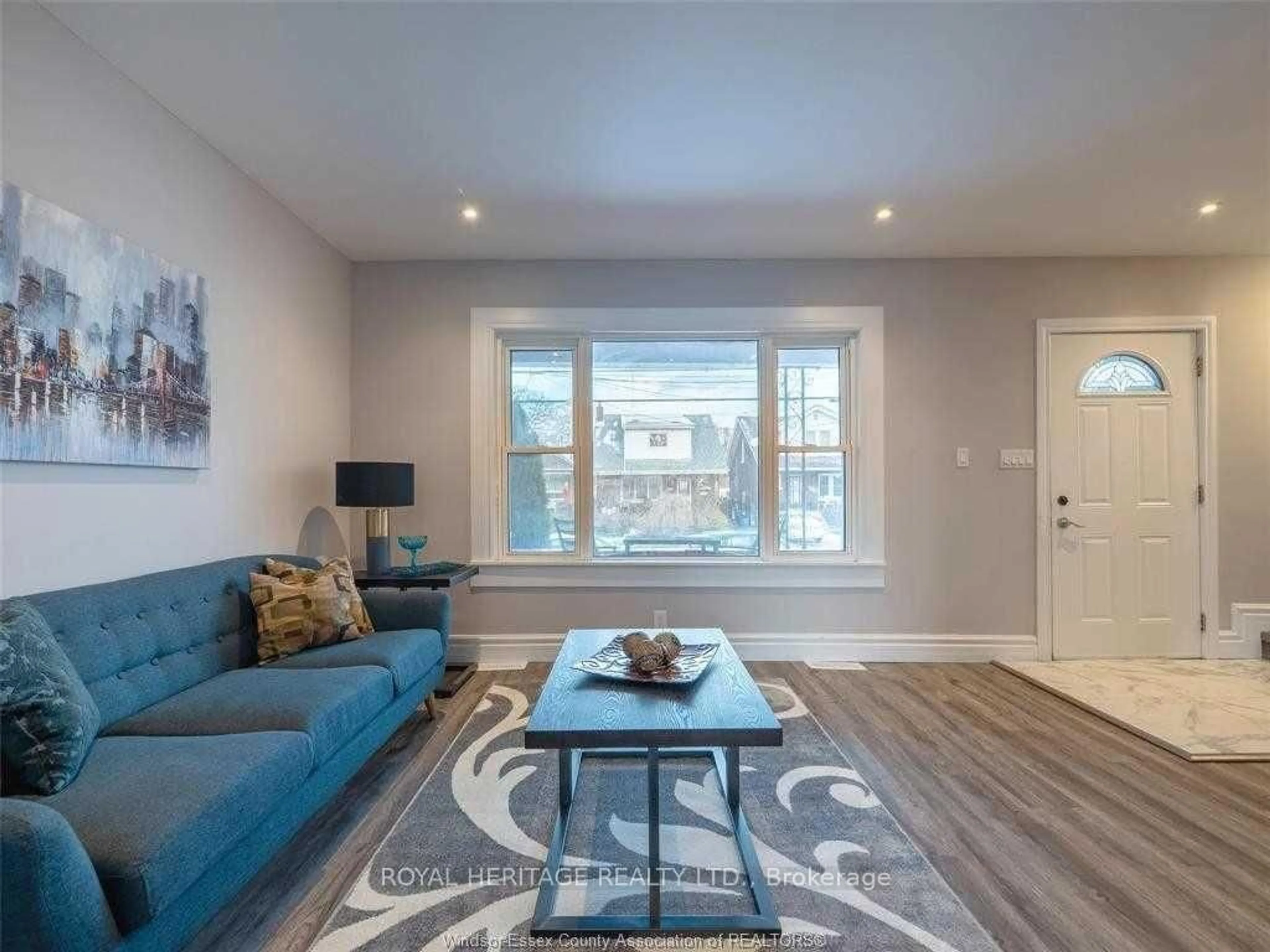 Living room with furniture, wood/laminate floor for 1165 Elm Ave, Windsor Ontario N9A 5J1