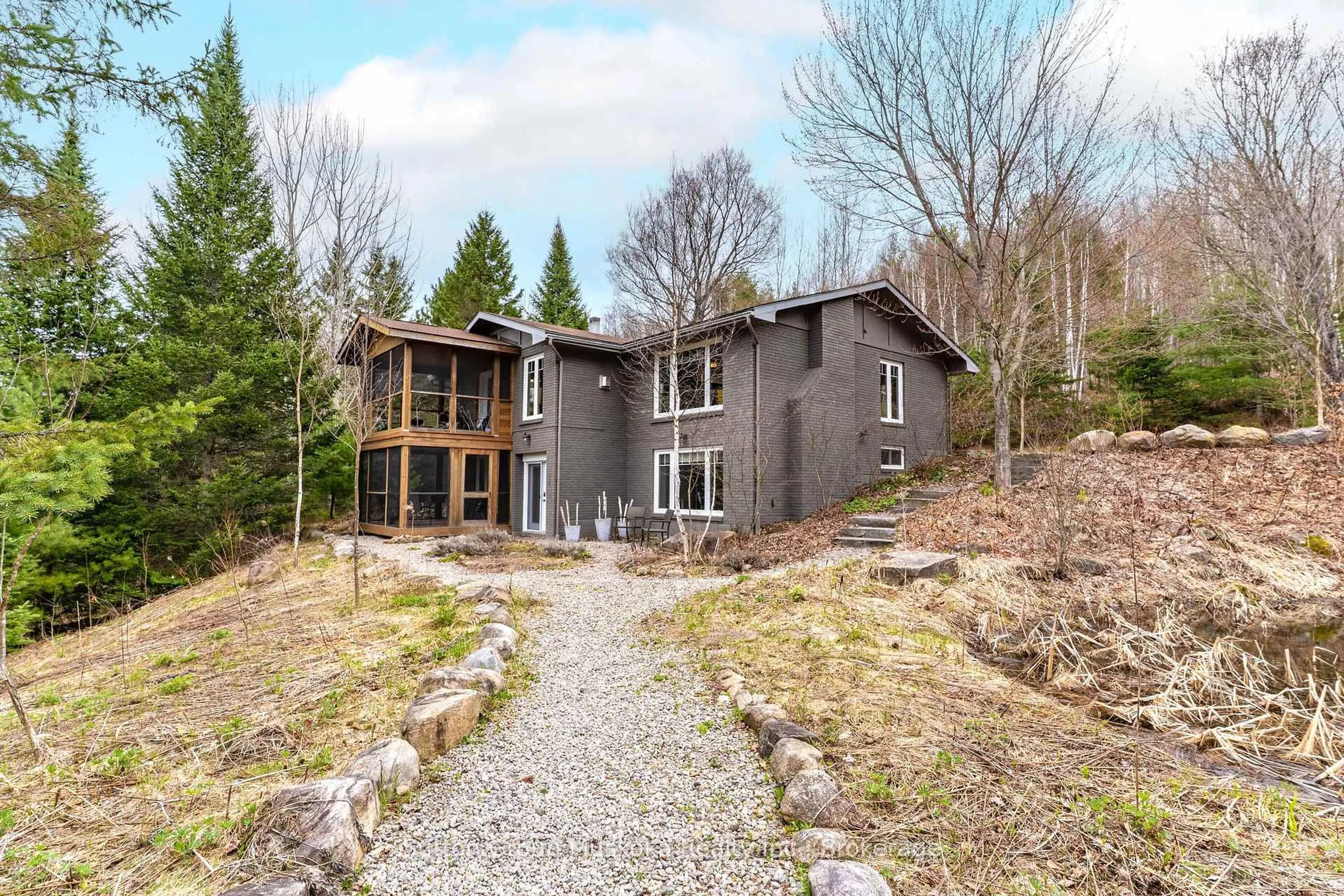 A pic from outside/outdoor area/front of a property/back of a property/a pic from drone, unknown for 209 Swallowdale Rd, Huntsville Ontario P1H 0A5