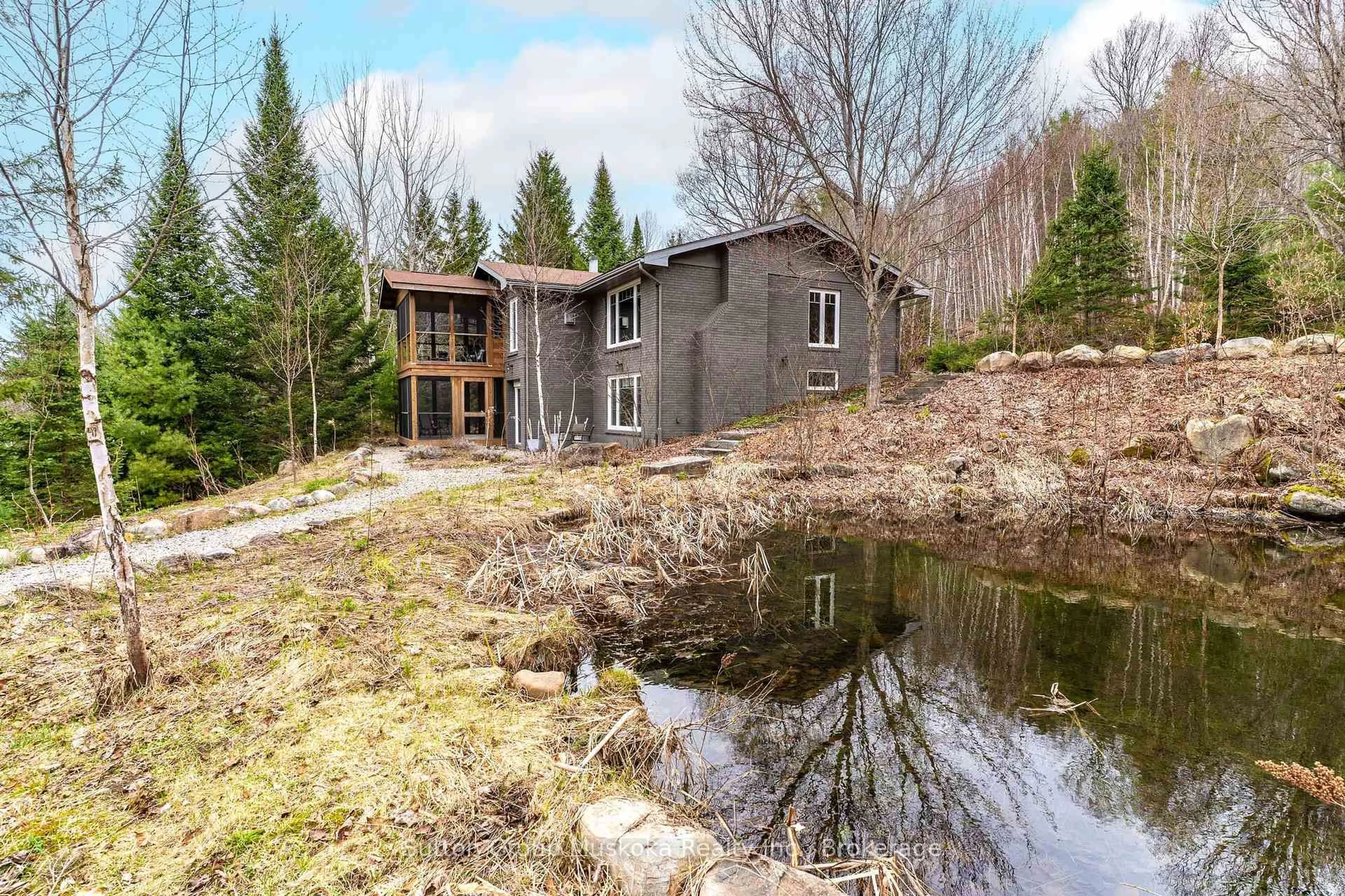 A pic from outside/outdoor area/front of a property/back of a property/a pic from drone, water/lake/river/ocean view for 209 Swallowdale Rd, Huntsville Ontario P1H 0A5